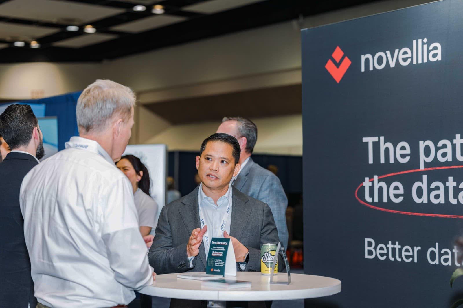 Healthcare professionals visiting Novellia exhibit at PMWC 2026 in Santa Clara Bay Area by JY Studio