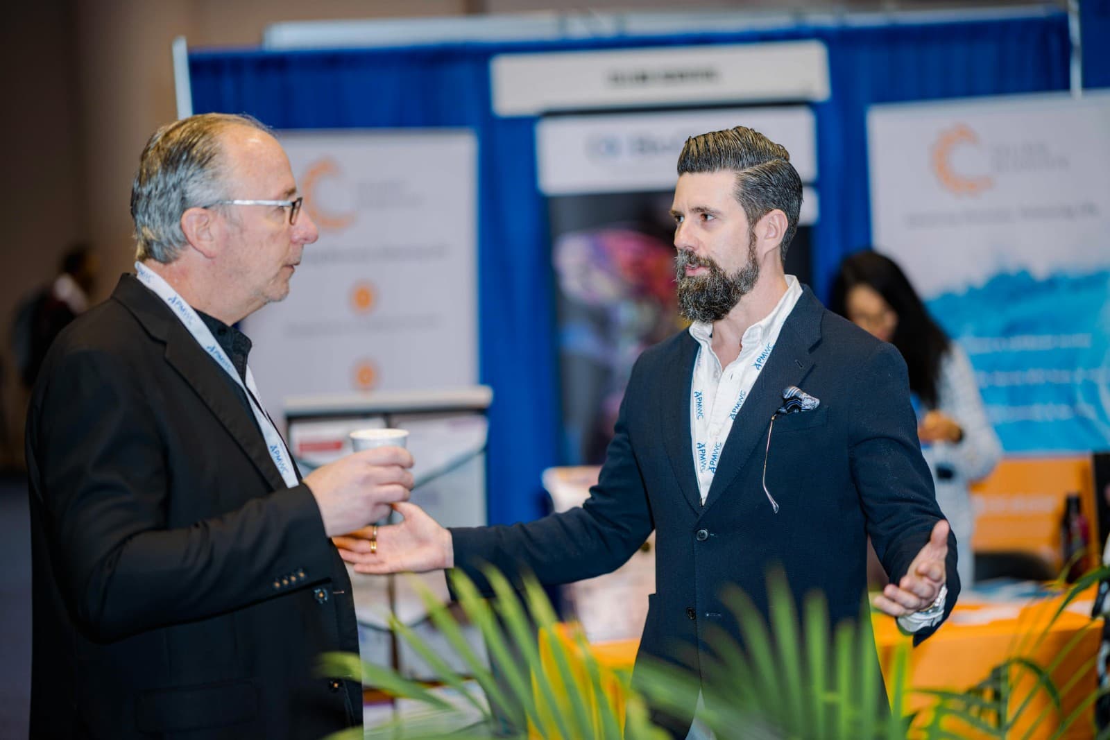 Wide angle shot of PMWC 2026 exhibition hall with Novellia booth in Santa Clara Silicon Valley by JY Studio