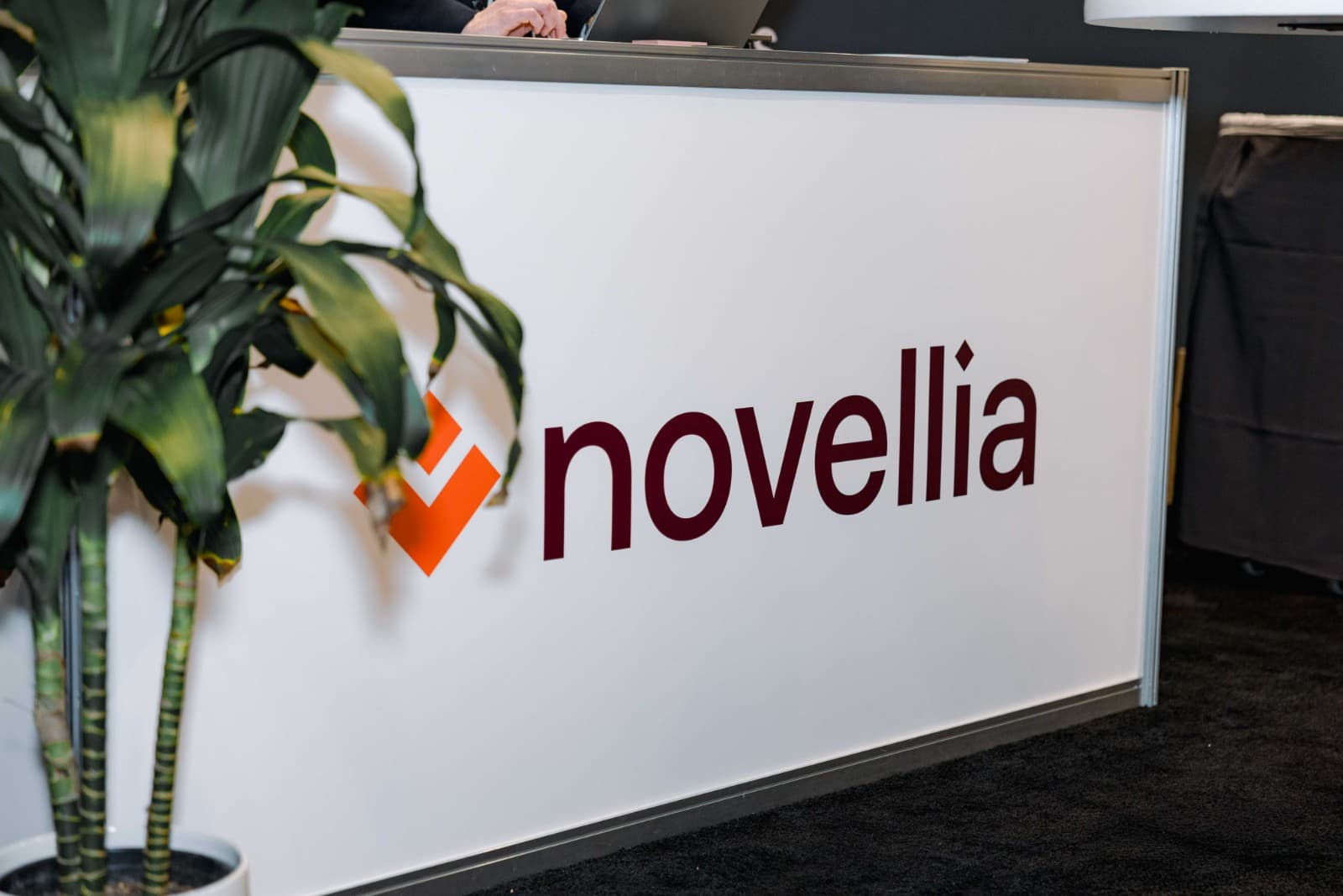 Novellia booth visitors exploring precision medicine solutions at PMWC 2026 Bay Area by JY Studio