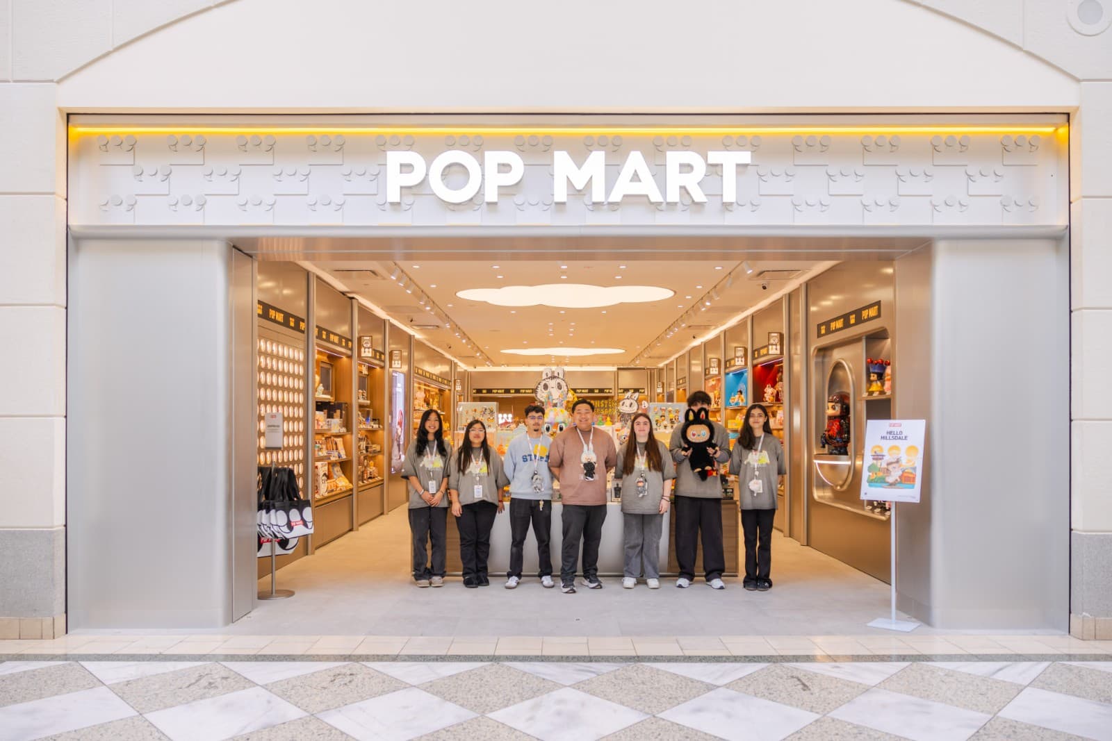 Pop Mart fans posing with life-size character displays at Hillsdale Mall San Mateo opening by JY Studio