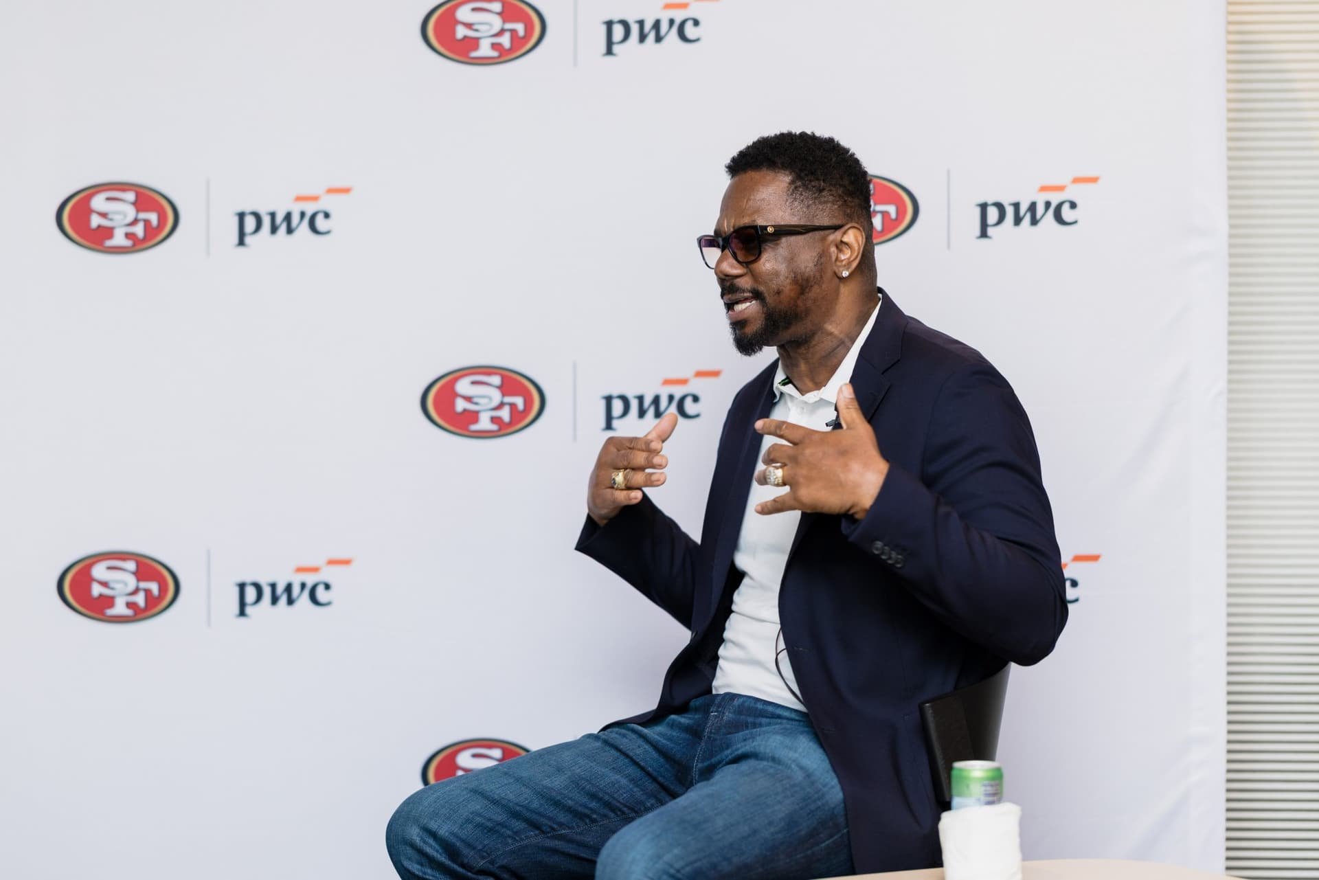 49ers legend speaking animatedly during the fireside chat at the PwC x 49ers event at PwC Silicon Valley in San Jose by JY Studio