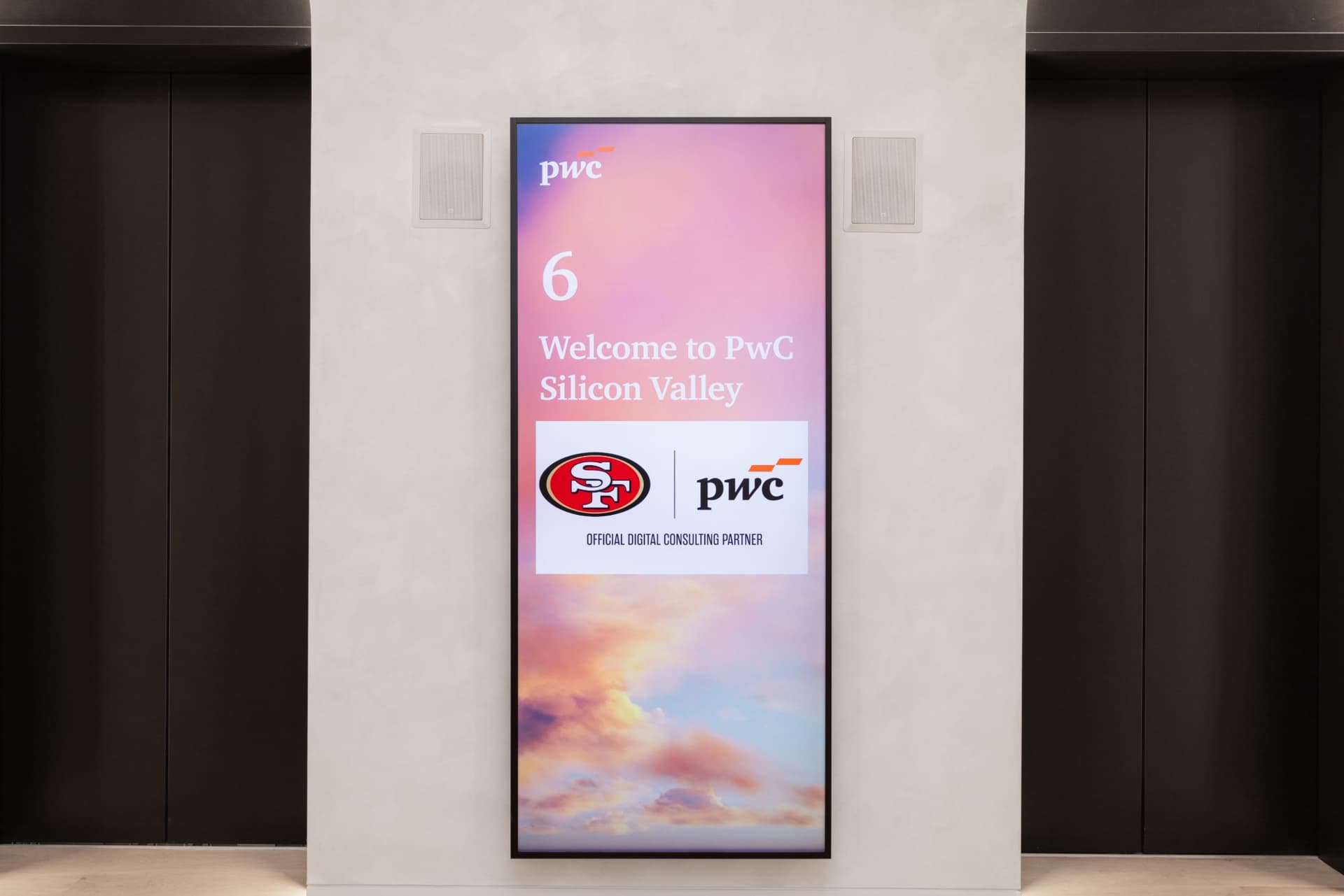Welcome to PwC Silicon Valley screen with the 49ers and PwC Official Digital Consulting Partner logos in the elevator lobby at the PwC x 49ers event at PwC Silicon Valley in San Jose by JY Studio