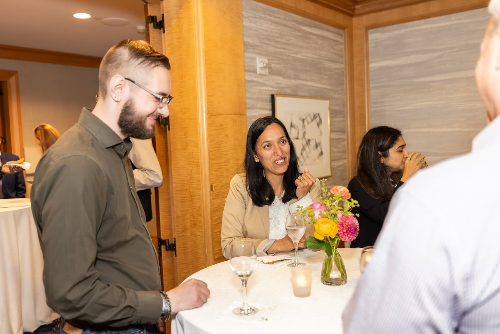 Attendees mingling in the private dining room at the Select World Services cybersecurity gathering in San Francisco