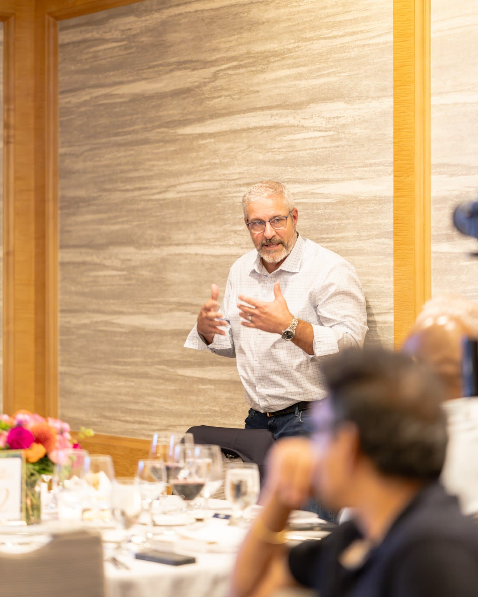 Guests deep in conversation over dinner at the Select World Services cybersecurity executive event in San Francisco