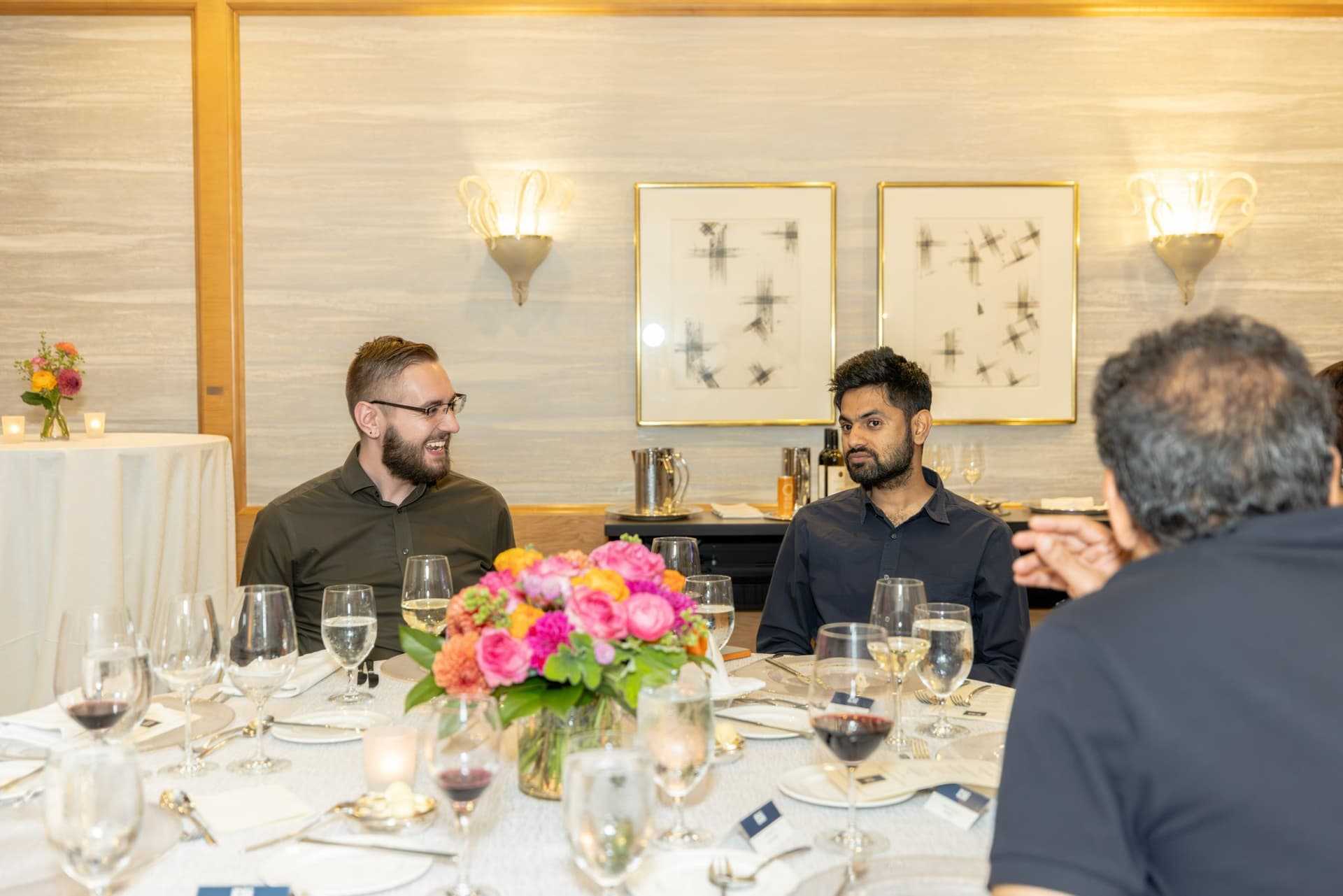 Attendees listening to remarks during the Select World Services cybersecurity executive dinner in San Francisco