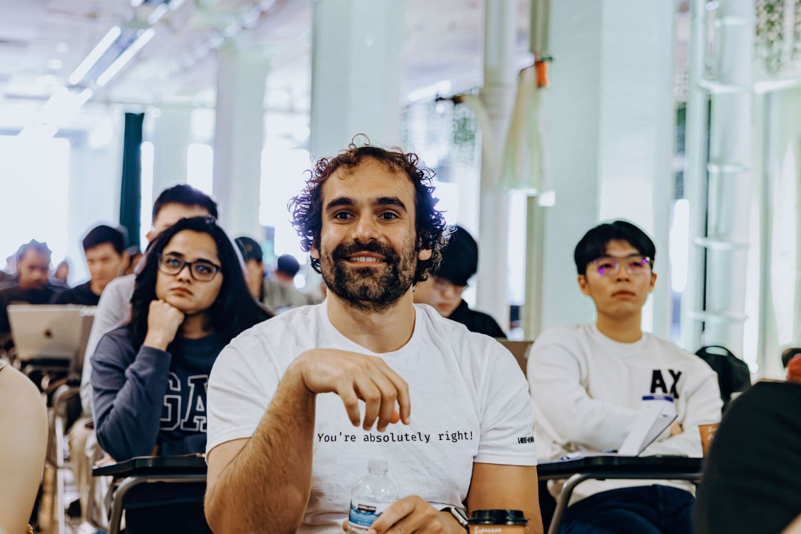 Participants focused on their screens during TRAE Hackathon in San Francisco Bay Area by JY Studio