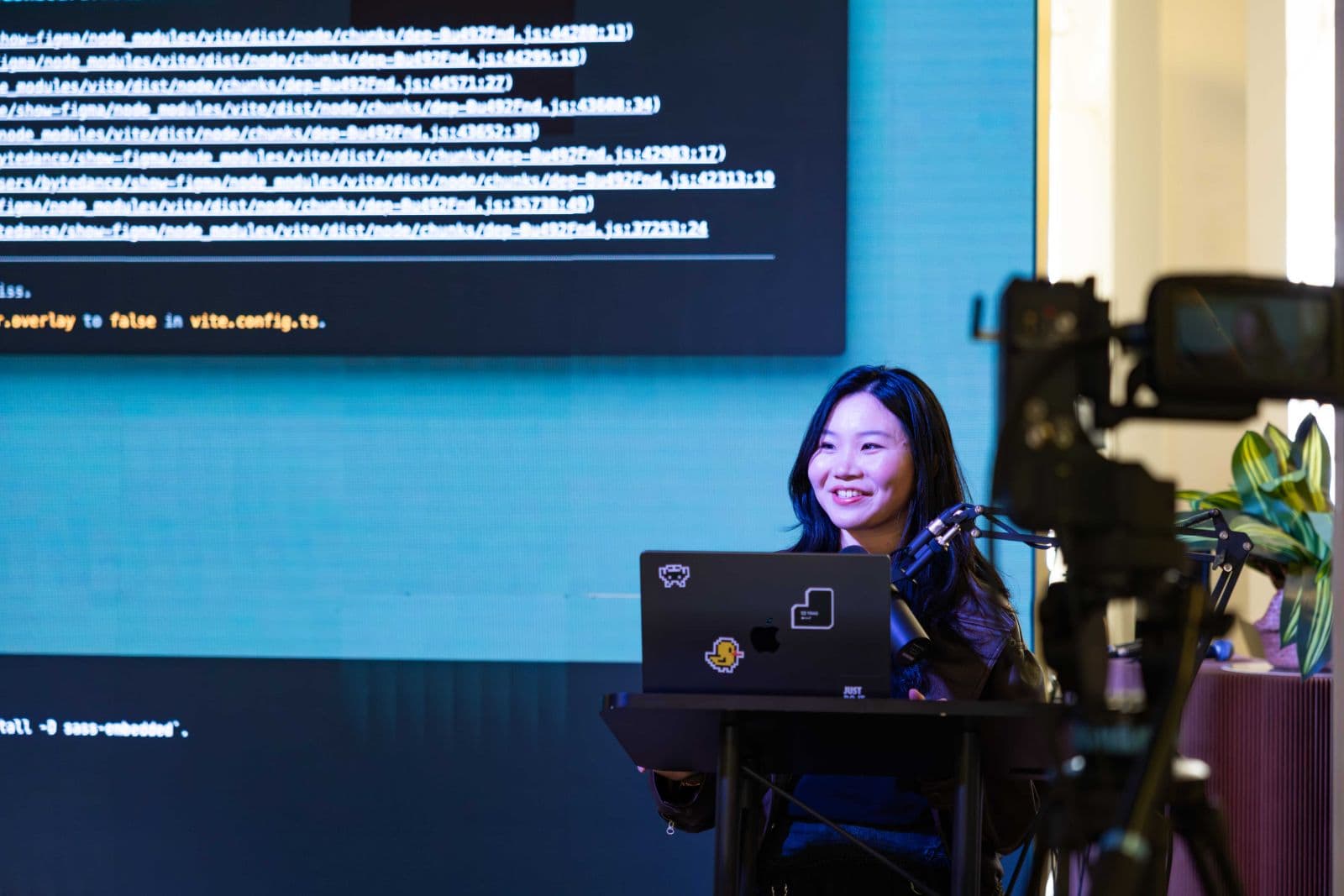 Keynote speaker presenting on stage at TRAE Hackathon #SFTechWeek in San Francisco by JY Studio