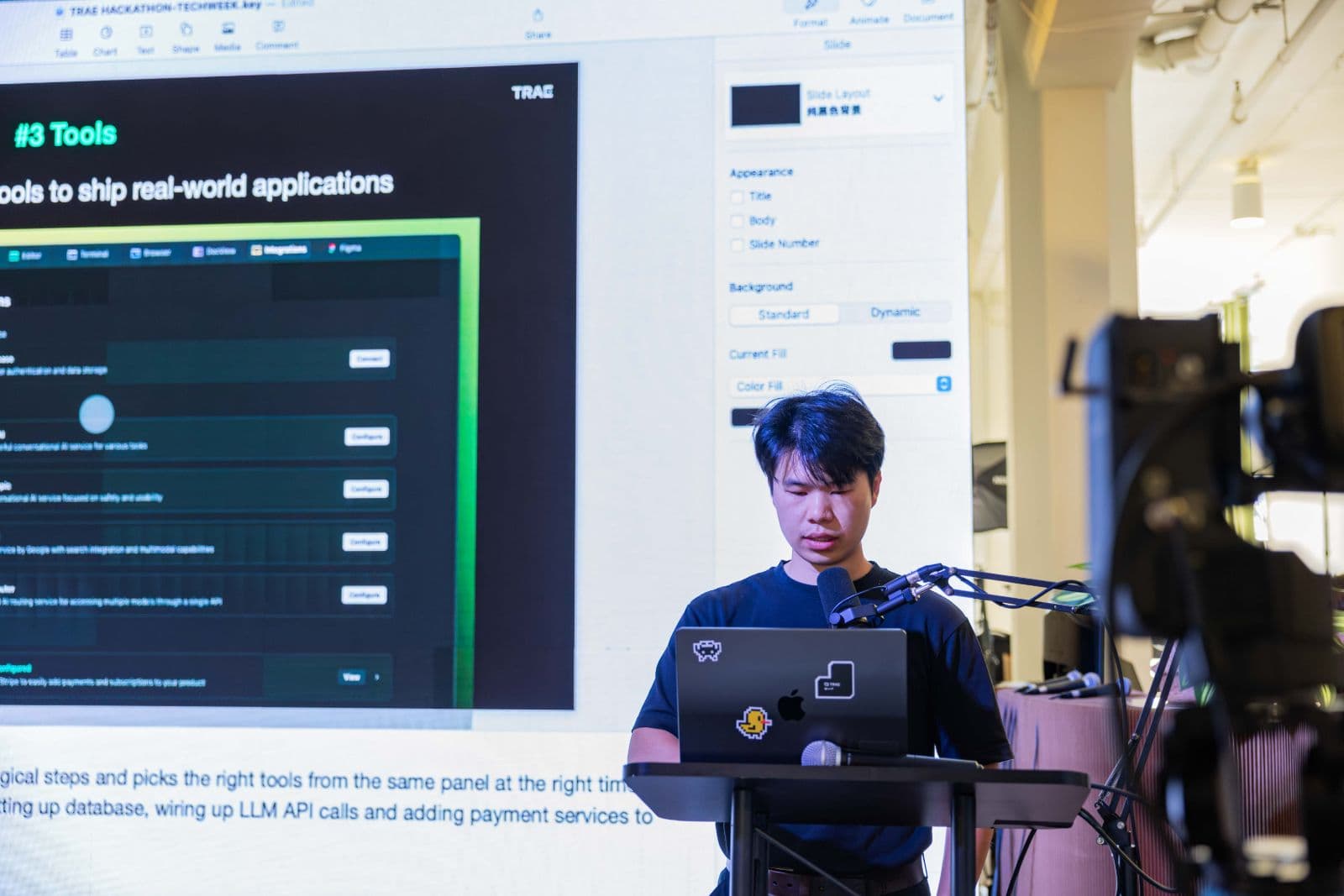 Close-up of developers coding on laptops during the TRAE Hackathon in Silicon Valley by JY Studio