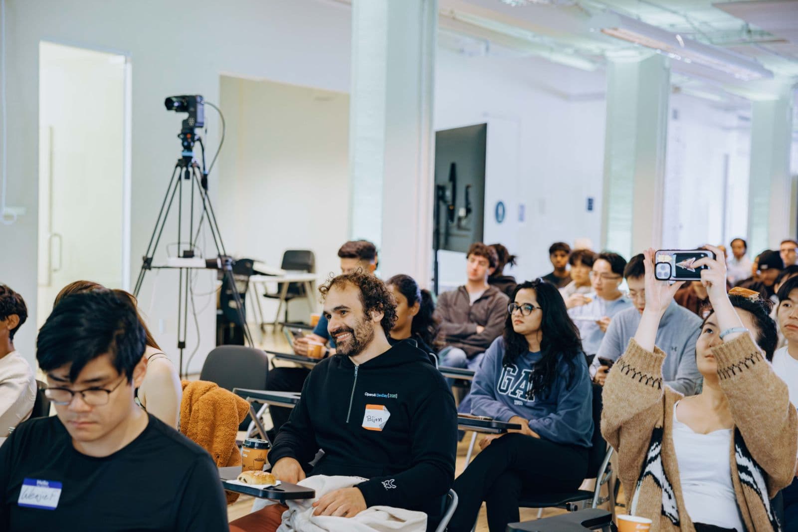 Attendees networking and exchanging ideas at TRAE Hackathon tech event in Bay Area by JY Studio