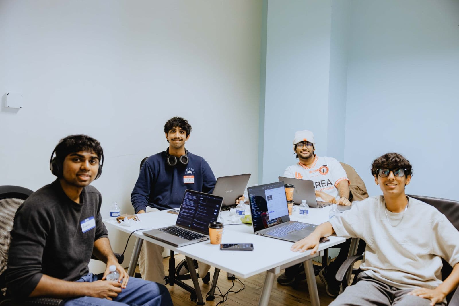 Candid networking moments between tech professionals at TRAE Hackathon in San Francisco by JY Studio