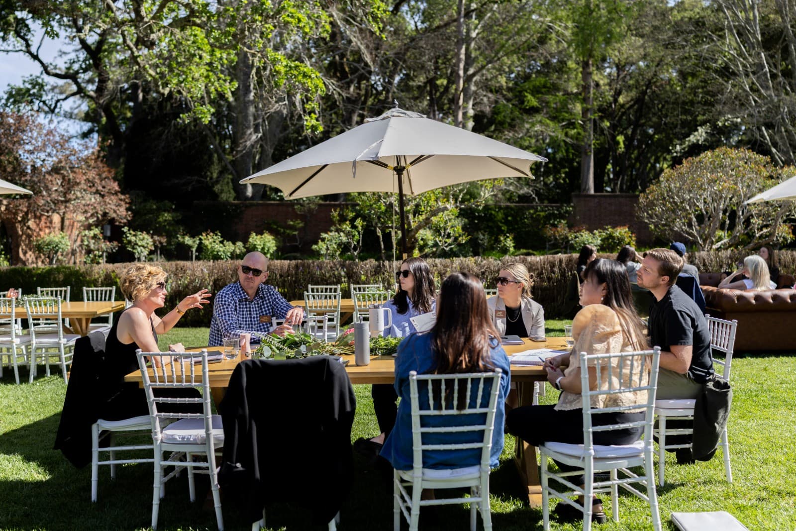 Candid networking between Zapier team members at Filoli Garden terrace by JY Studio