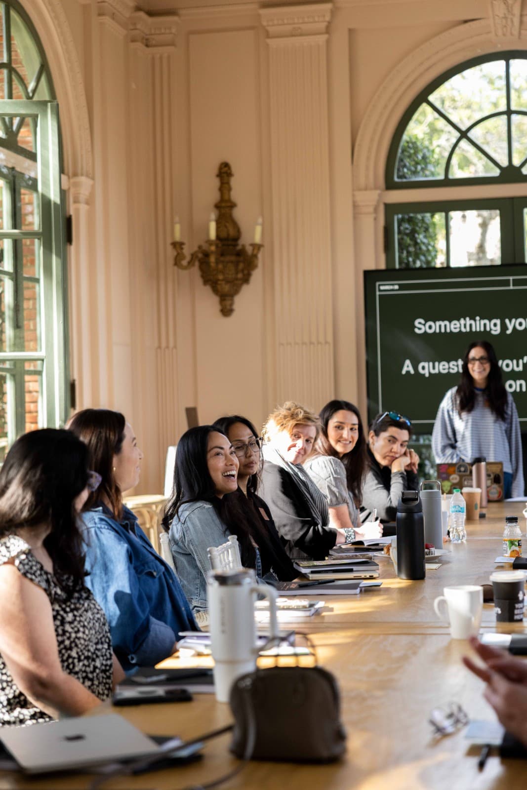 Zapier employees in small group brainstorm at Filoli Historic House offsite by JY Studio
