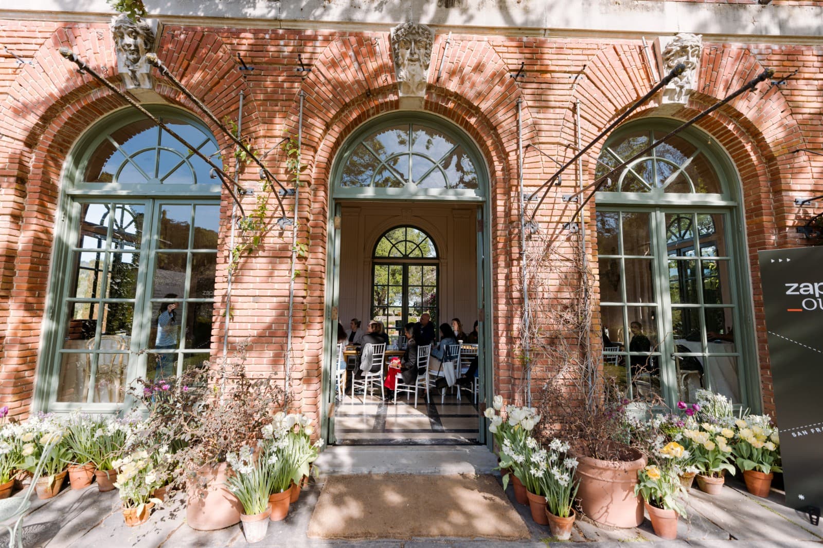 Zapier employees posing with garden backdrop at Filoli Historic Garden by JY Studio