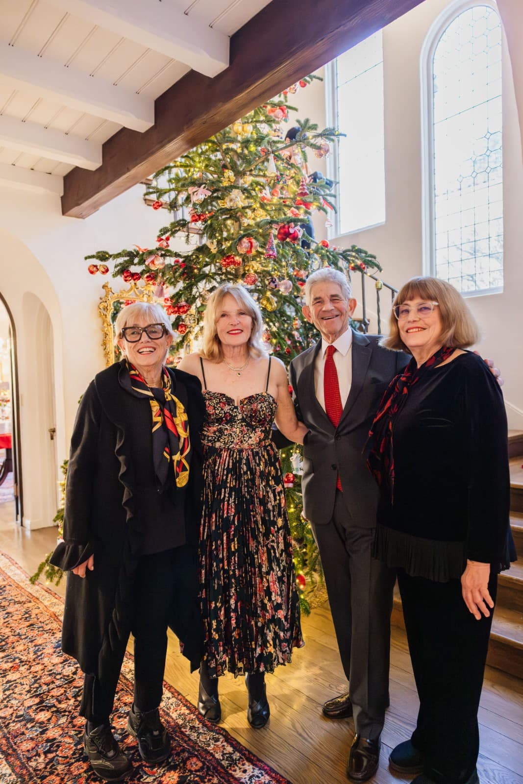 Guests enjoying festive holiday decorations at family Christmas party in Oakland San Francisco Bay Area by JY Studio