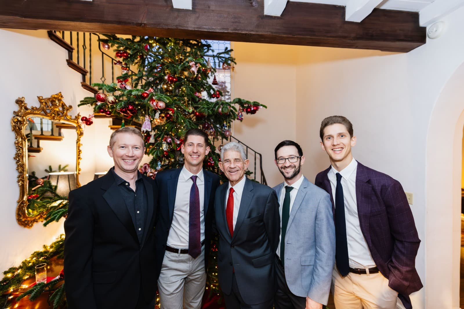 Holiday party guests gathering and celebrating at Christmas event in Oakland Bay Area photographed by JY Studio