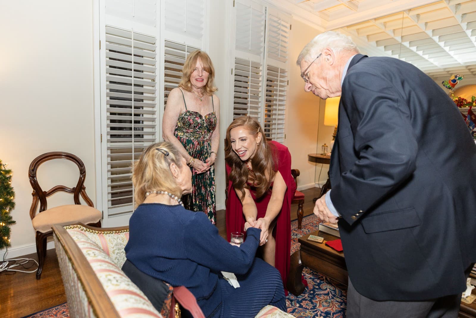 Joyful gift exchange and festive atmosphere at Oakland Christmas party in San Francisco Bay Area by JY Studio