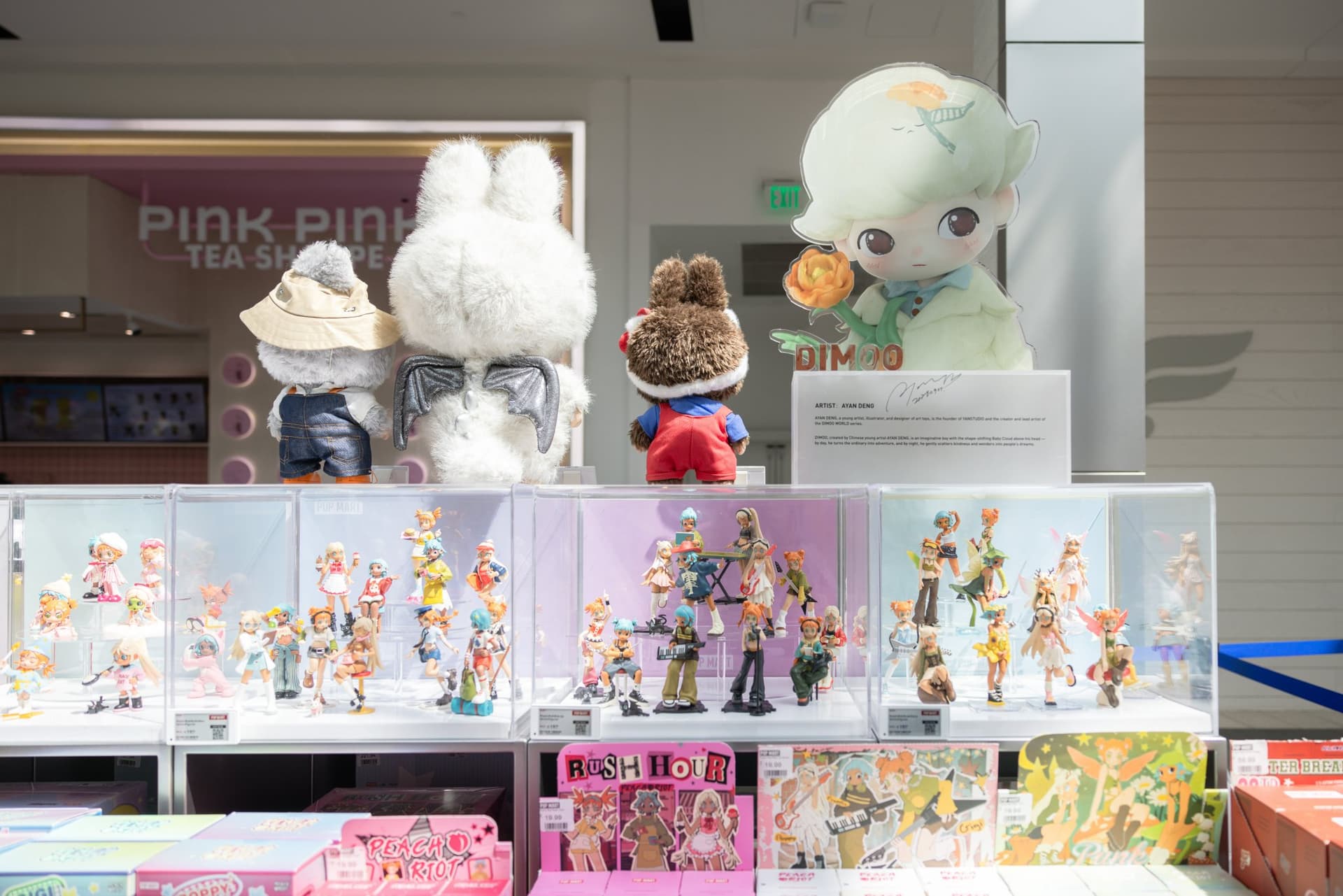 DIMOO art toy showcase with large DIMOO figures and collectibles at the Pop Mart DIMOO WORLD x PIXAR pop-up at Westfield Valley Fair in Santa Clara by JY Studio