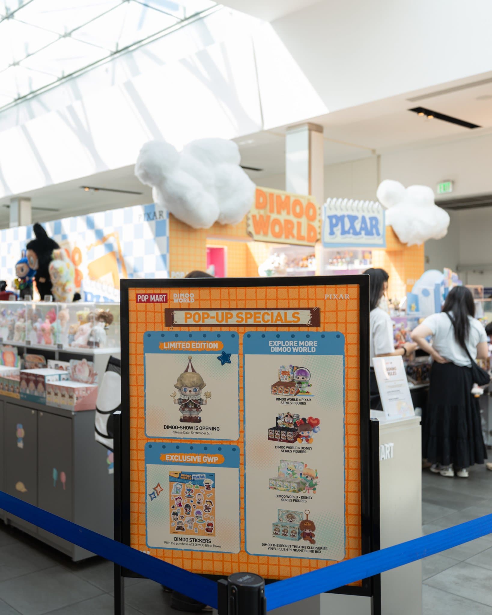 Pop-Up Specials sign with the limited edition DIMOO-SHOW figure at the Pop Mart DIMOO WORLD x PIXAR pop-up at Westfield Valley Fair in Santa Clara by JY Studio
