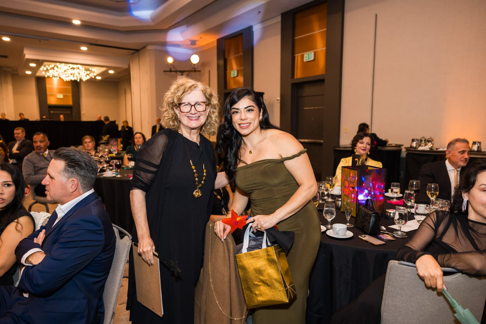 Guests celebrating beside the red carpet aisle with gift bags in the ballroom at Admin Awards 2026 at SFO Marriott Waterfront, Burlingame by JY Studio
