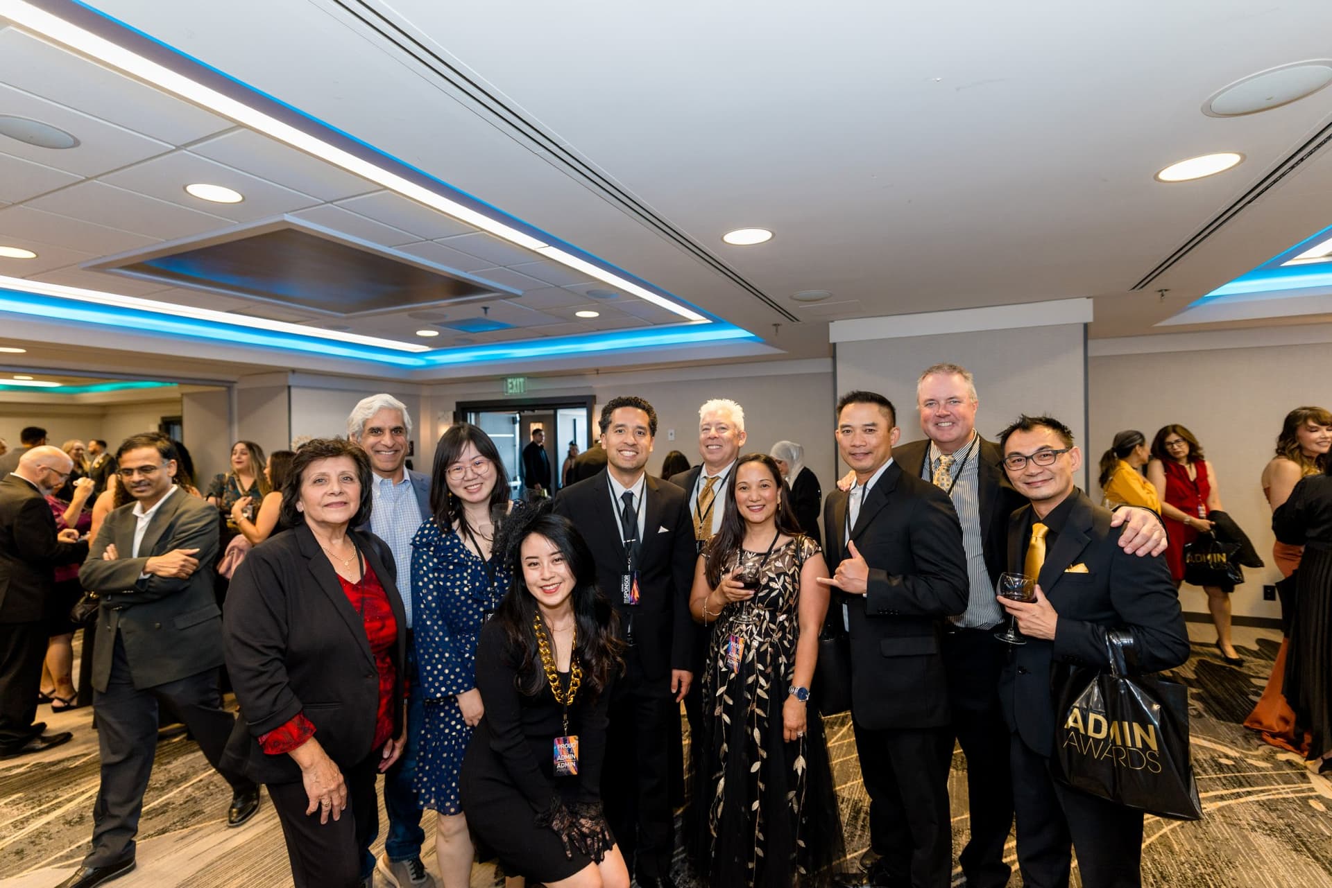 Large group of attendees posing together at the cocktail reception at Admin Awards 2026 at SFO Marriott Waterfront, Burlingame by JY Studio