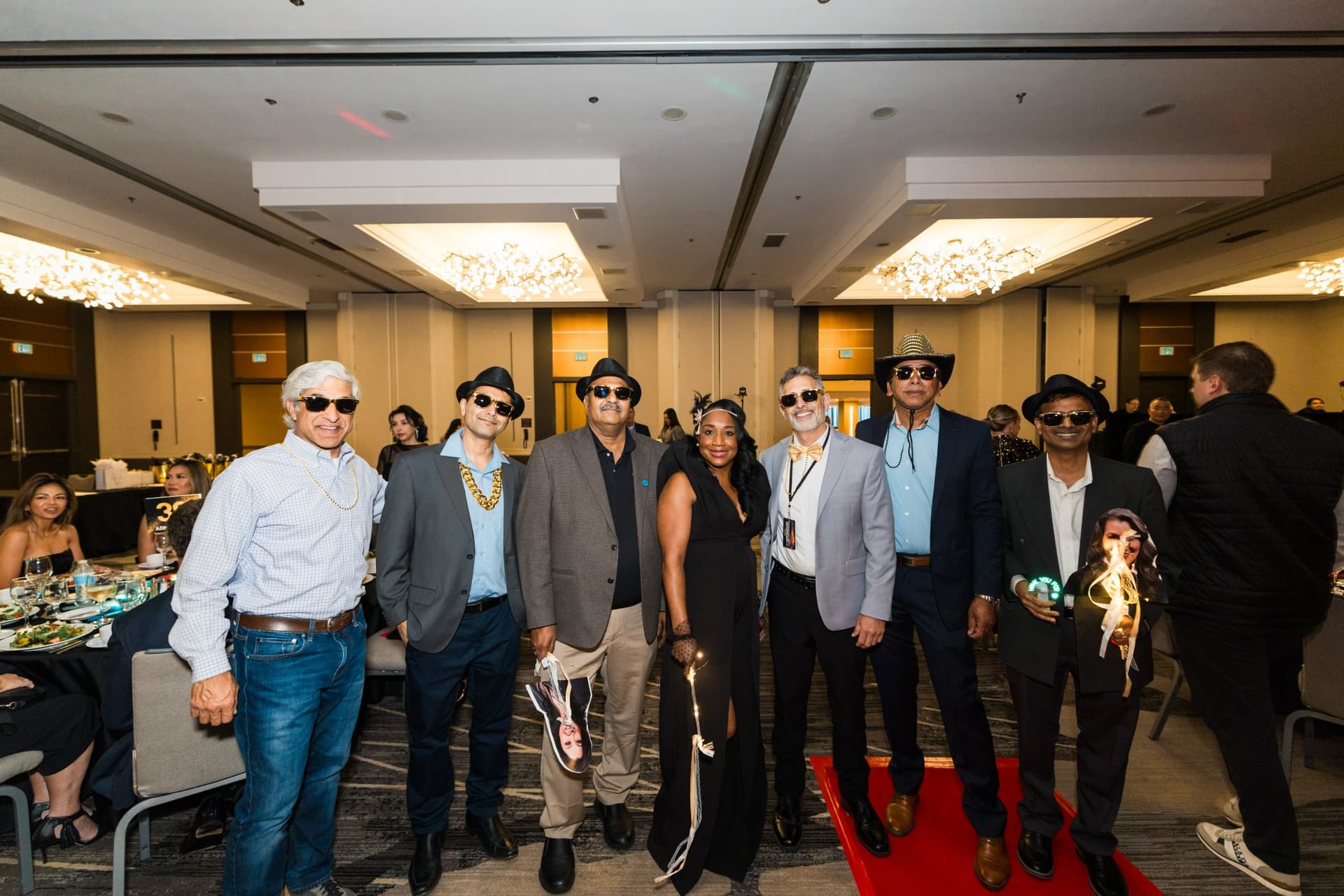 Guests in sunglasses and fedoras posing on the red carpet at Admin Awards 2026 at SFO Marriott Waterfront, Burlingame by JY Studio