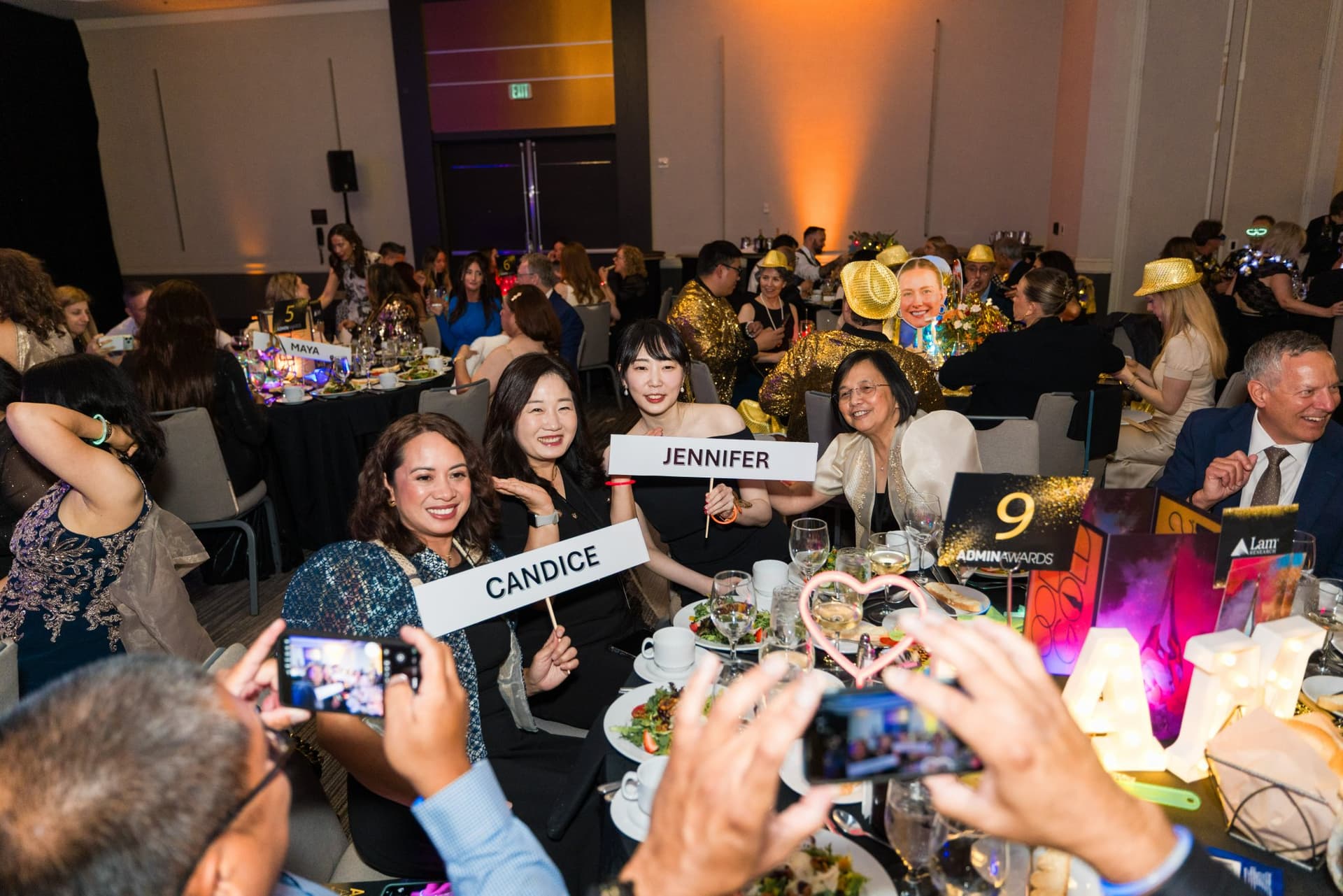 Guests holding up name signs while supporters capture the moment on their phones at Admin Awards 2026 at SFO Marriott Waterfront, Burlingame by JY Studio