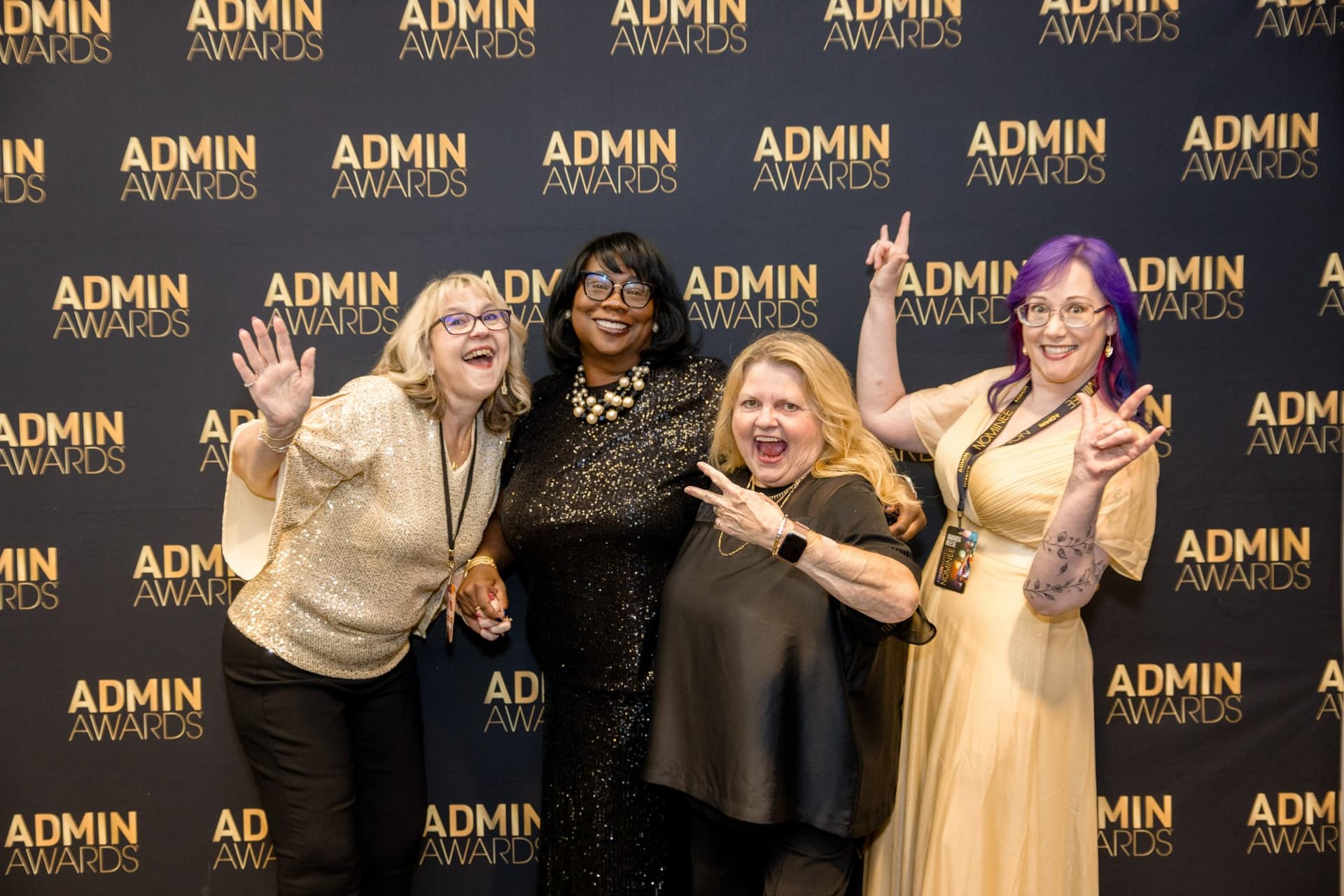 Four guests posing playfully at the Admin Awards step-and-repeat at Admin Awards 2026 at SFO Marriott Waterfront, Burlingame by JY Studio