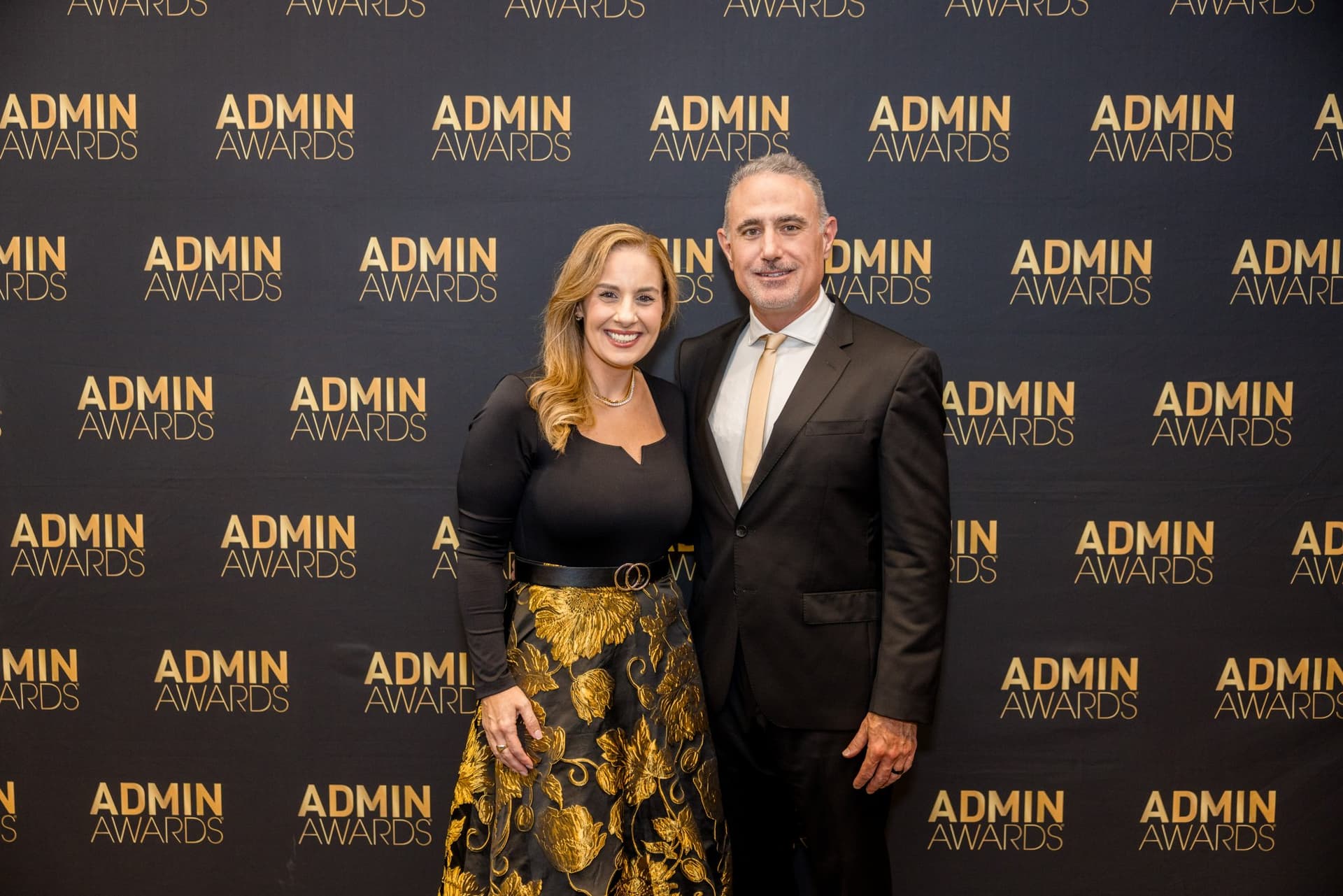 Couple posing at the Admin Awards step-and-repeat at Admin Awards 2026 at SFO Marriott Waterfront, Burlingame by JY Studio