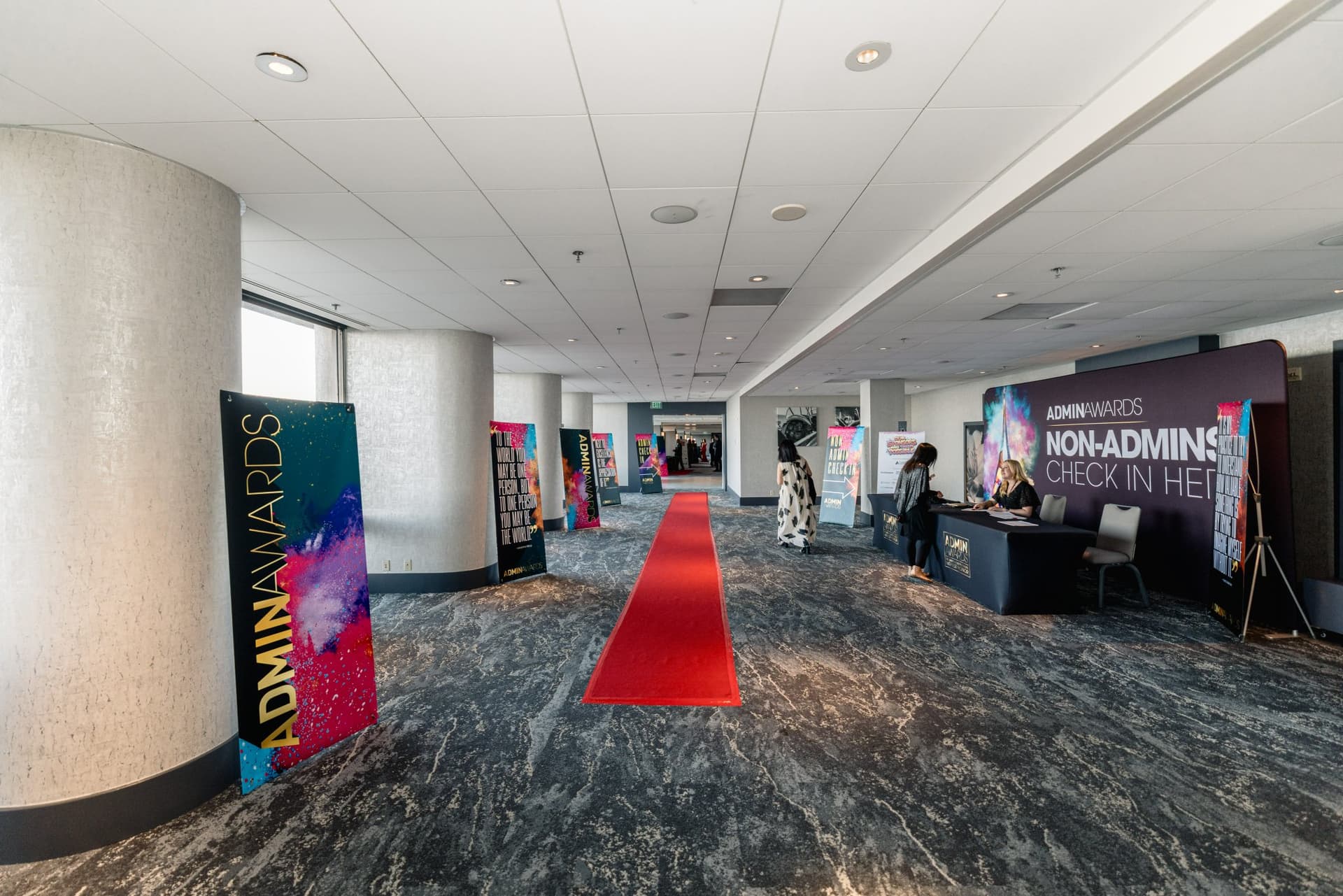 Pre-function hallway with red carpet, Admin Awards signage and check-in tables at Admin Awards 2026 at SFO Marriott Waterfront, Burlingame by JY Studio
