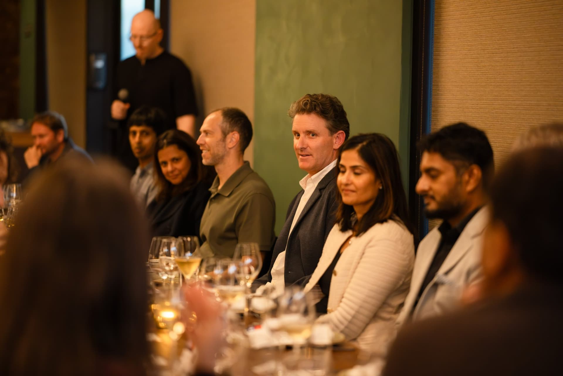 Tech executives listening as the AI Insider host speaks at the Business Insider AI Insider executive dinner The Great Coding Reset during SF Tech Week 2026 in San Francisco by JY Studio