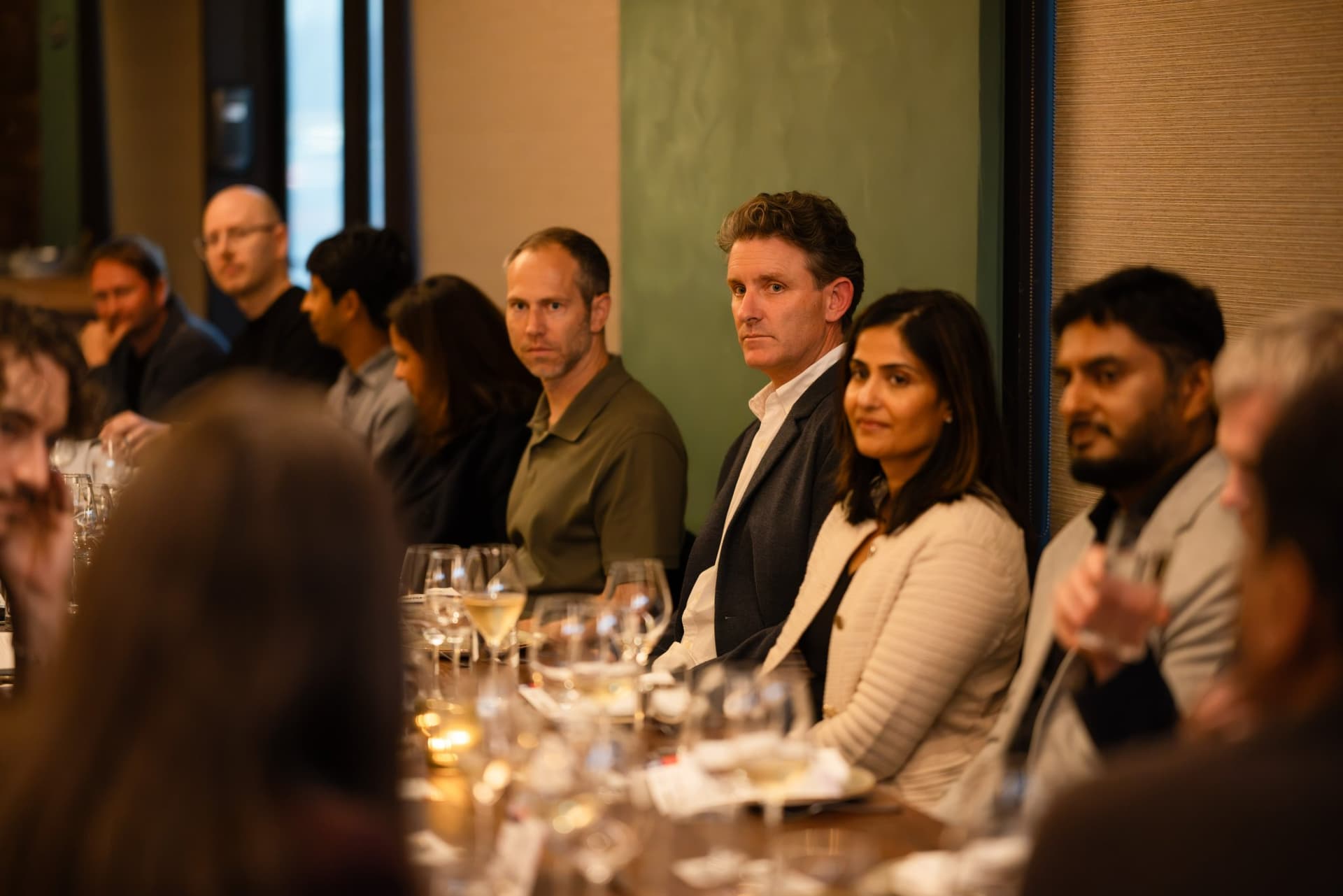 Executives smiling during the AI agents roundtable conversation at the Business Insider AI Insider executive dinner The Great Coding Reset during SF Tech Week 2026 in San Francisco by JY Studio