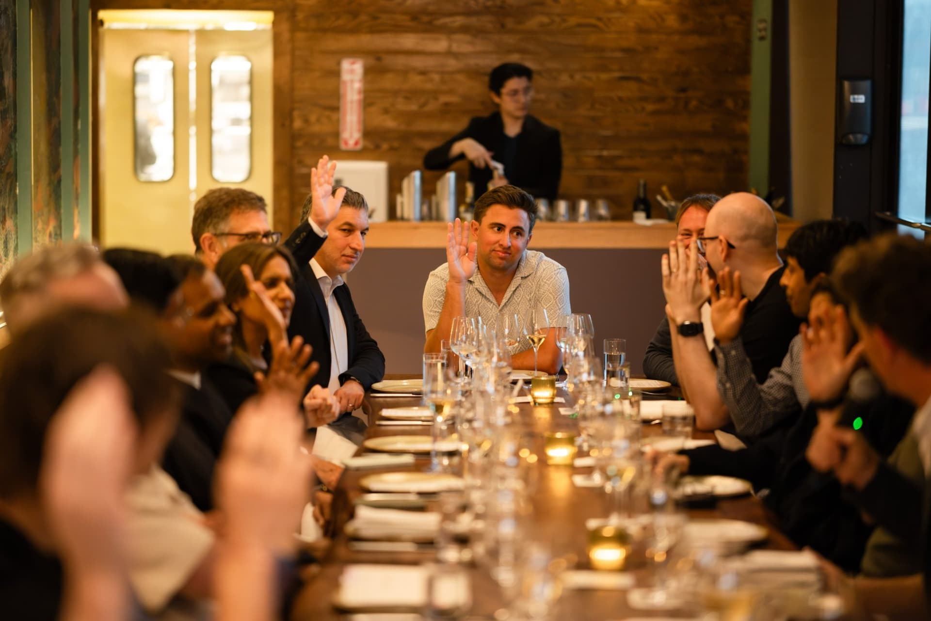 Every hand raised when executives were asked who had an AI agent help them at work that day at the Business Insider AI Insider executive dinner The Great Coding Reset during SF Tech Week 2026 in San Francisco by JY Studio