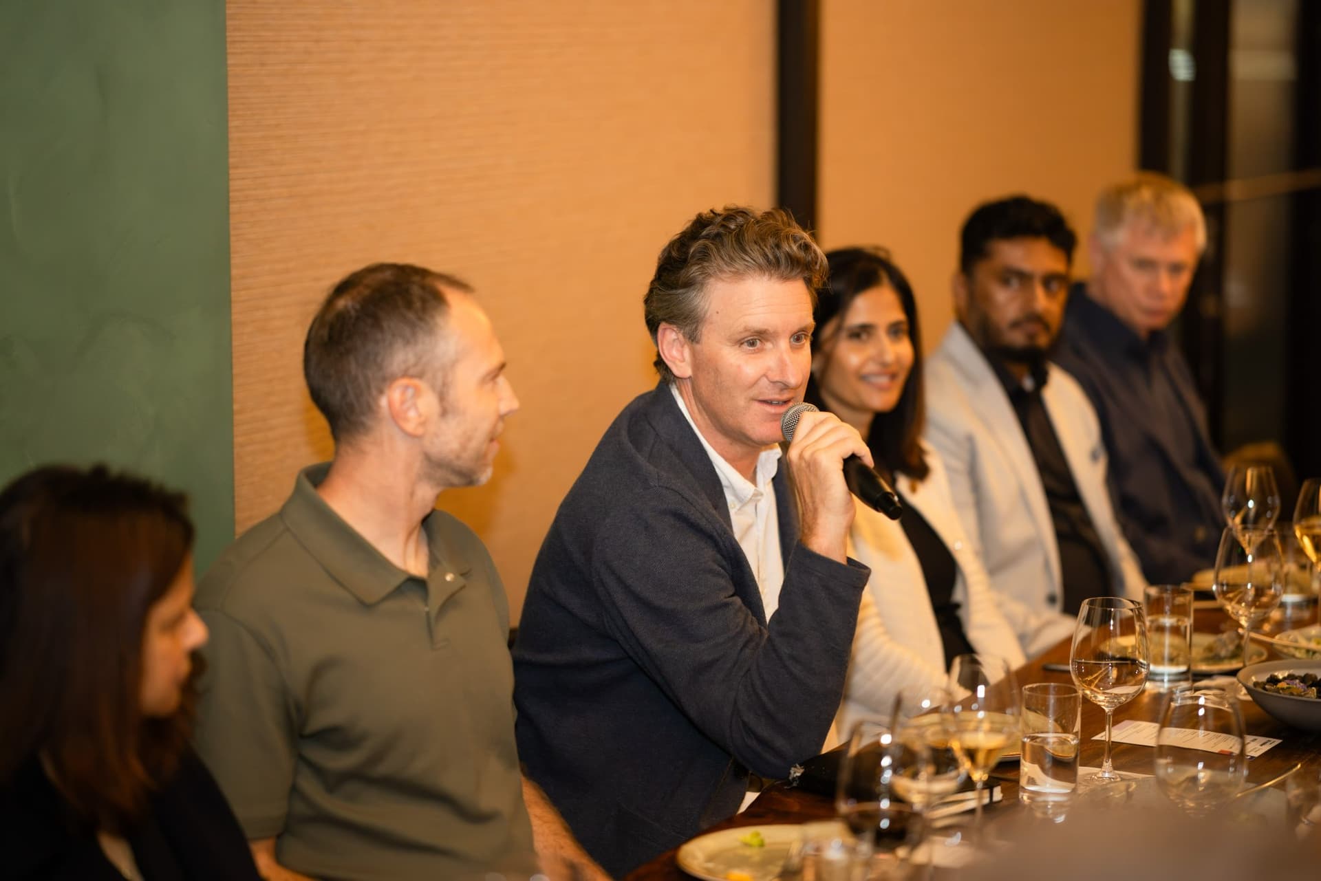 CTO speaking with a microphone during the AI agents discussion at the Business Insider AI Insider executive dinner The Great Coding Reset during SF Tech Week 2026 in San Francisco by JY Studio