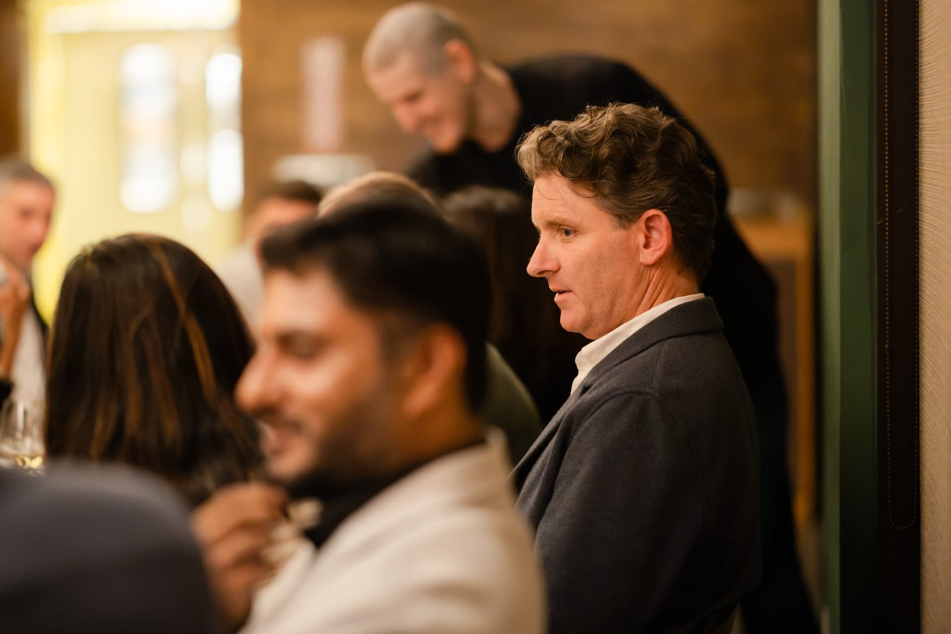 Executive listening closely during the dinner discussion at the Business Insider AI Insider executive dinner The Great Coding Reset during SF Tech Week 2026 in San Francisco by JY Studio