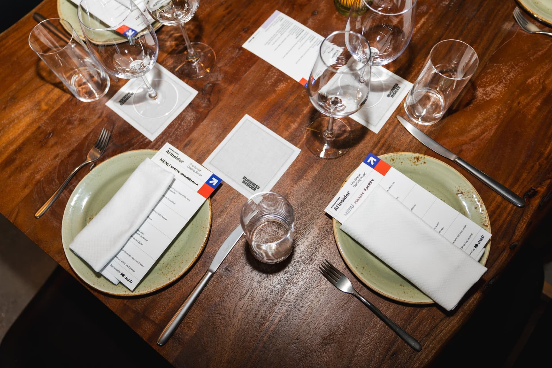 Place settings with AI Insider dinner menus on the table at the Business Insider AI Insider executive dinner The Great Coding Reset during SF Tech Week 2026 in San Francisco by JY Studio