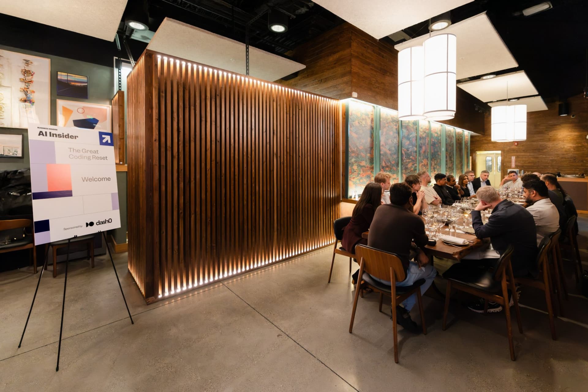 Dining room with the AI Insider welcome sign as the roundtable begins at the Business Insider AI Insider executive dinner The Great Coding Reset during SF Tech Week 2026 in San Francisco by JY Studio