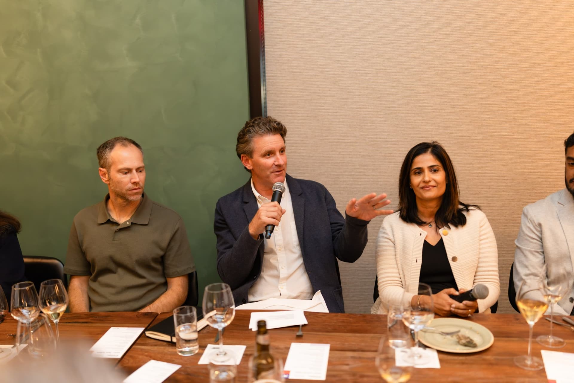 Three executives talking at the dinner table at the Business Insider AI Insider executive dinner The Great Coding Reset during SF Tech Week 2026 in San Francisco by JY Studio
