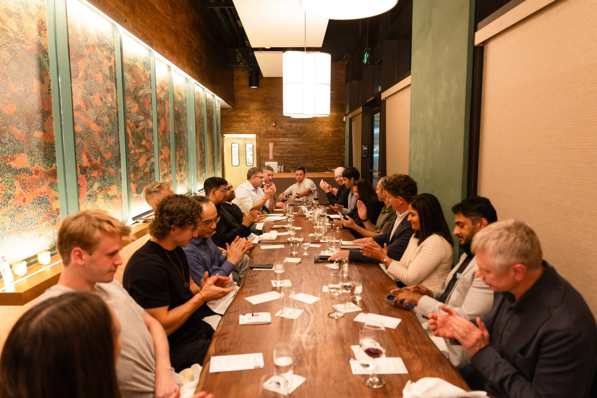Wide shot of the long dinner table under paper lanterns at the Business Insider AI Insider executive dinner The Great Coding Reset during SF Tech Week 2026 in San Francisco by JY Studio
