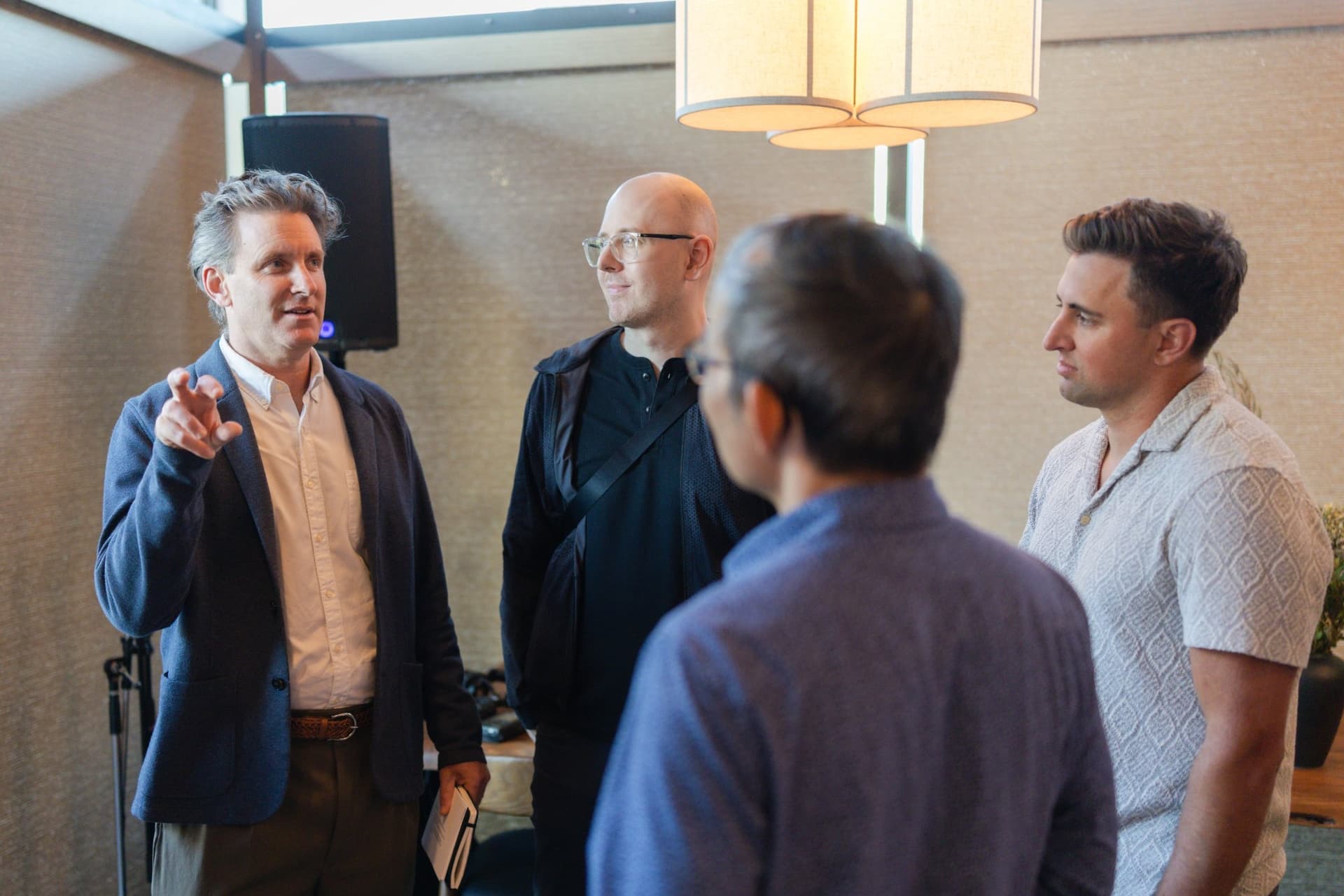 Executives chatting with drinks during the welcome reception at the Business Insider AI Insider executive dinner The Great Coding Reset during SF Tech Week 2026 in San Francisco by JY Studio