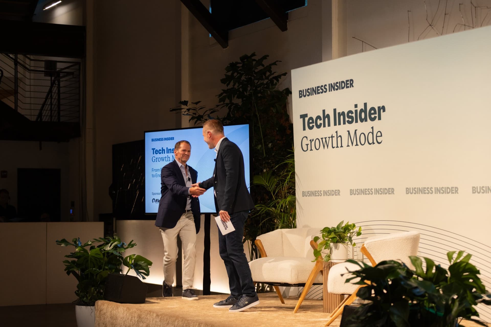 Ben Bergman shaking hands with Matt Murphy on stage at Business Insider Tech Insider: Growth Mode at The Pearl SF during SF Tech Week 2026 in San Francisco by JY Studio