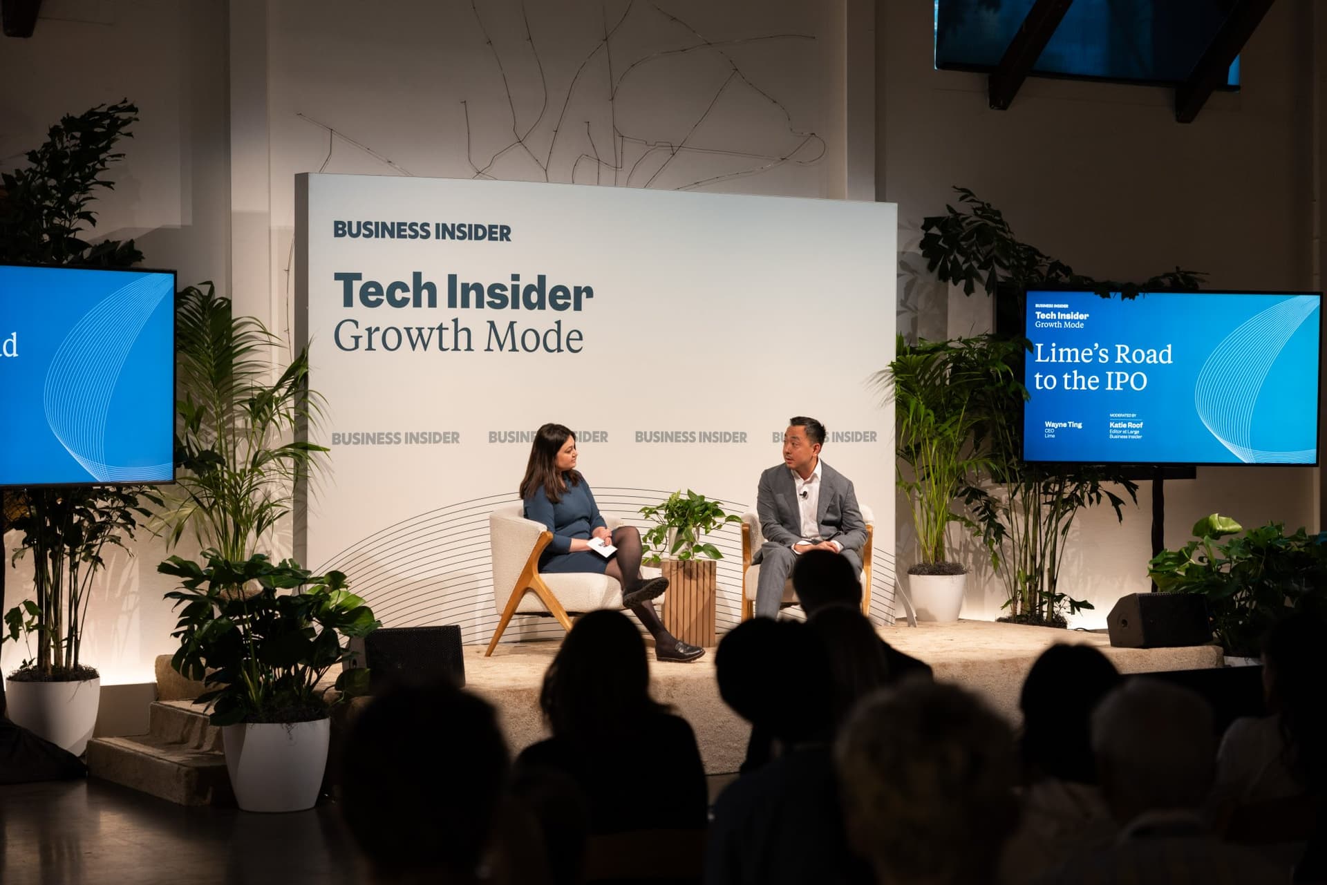 Katie Roof and Wayne Ting on stage between the Lime's Road to the IPO screens at Business Insider Tech Insider: Growth Mode at The Pearl SF during SF Tech Week 2026 in San Francisco by JY Studio