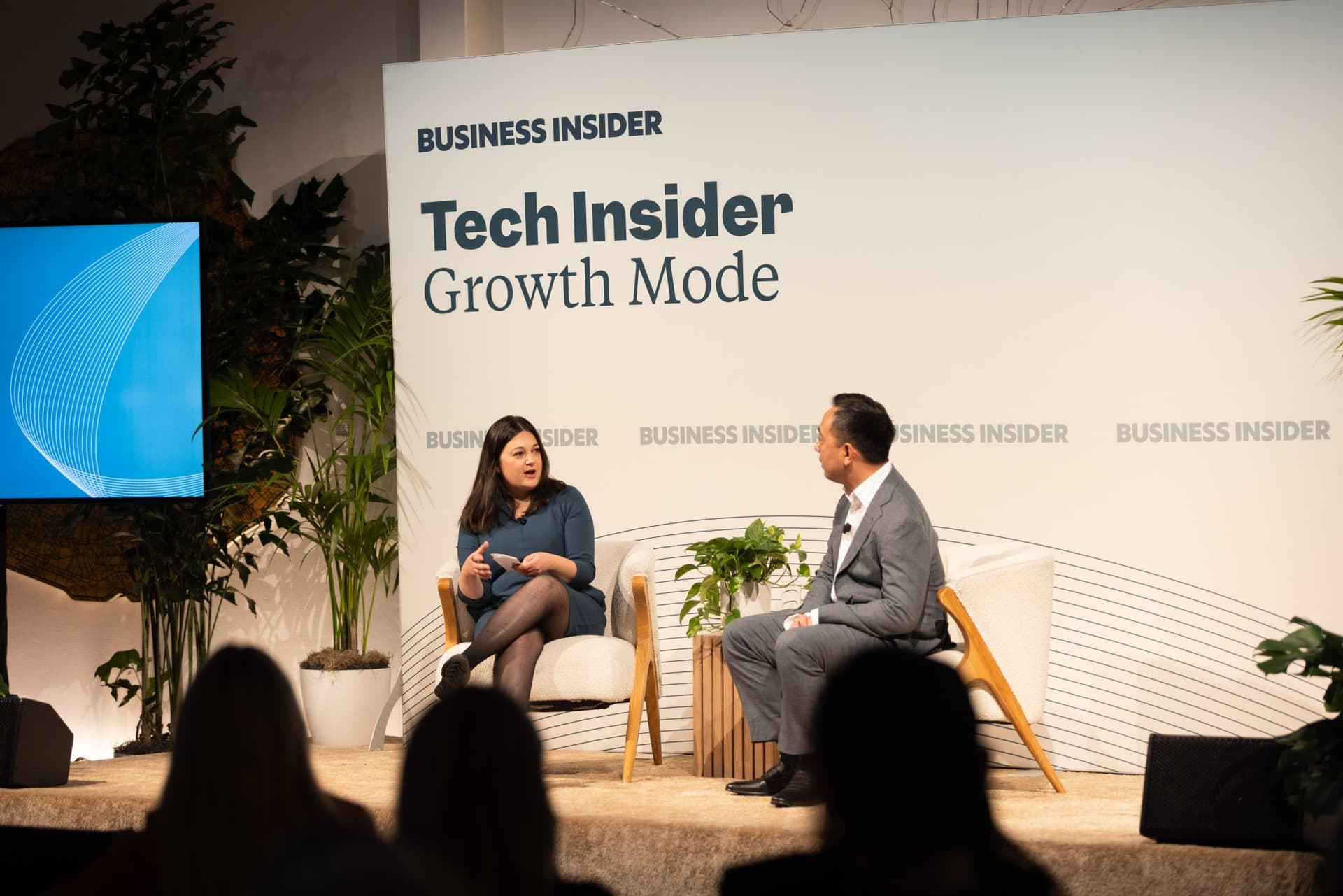 Audience silhouettes in front of Katie Roof and Wayne Ting on stage at Business Insider Tech Insider: Growth Mode at The Pearl SF during SF Tech Week 2026 in San Francisco by JY Studio