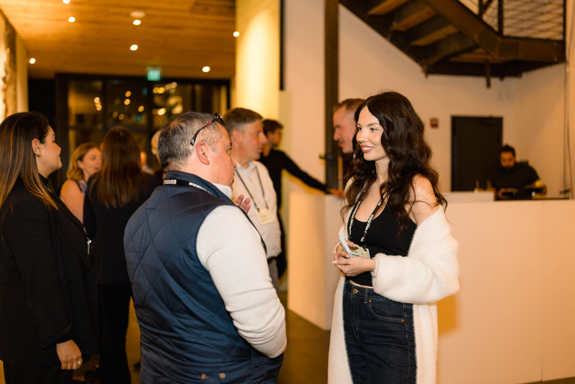 Guests talking near the bar during the networking reception at Business Insider Tech Insider: Growth Mode at The Pearl SF during SF Tech Week 2026 in San Francisco by JY Studio