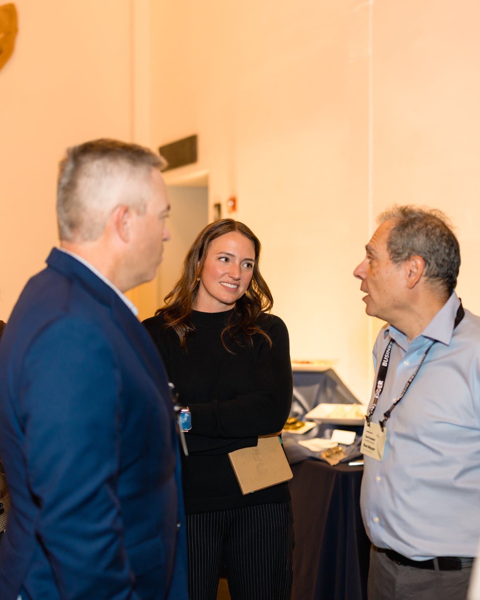 Three attendees in conversation during the reception at Business Insider Tech Insider: Growth Mode at The Pearl SF during SF Tech Week 2026 in San Francisco by JY Studio