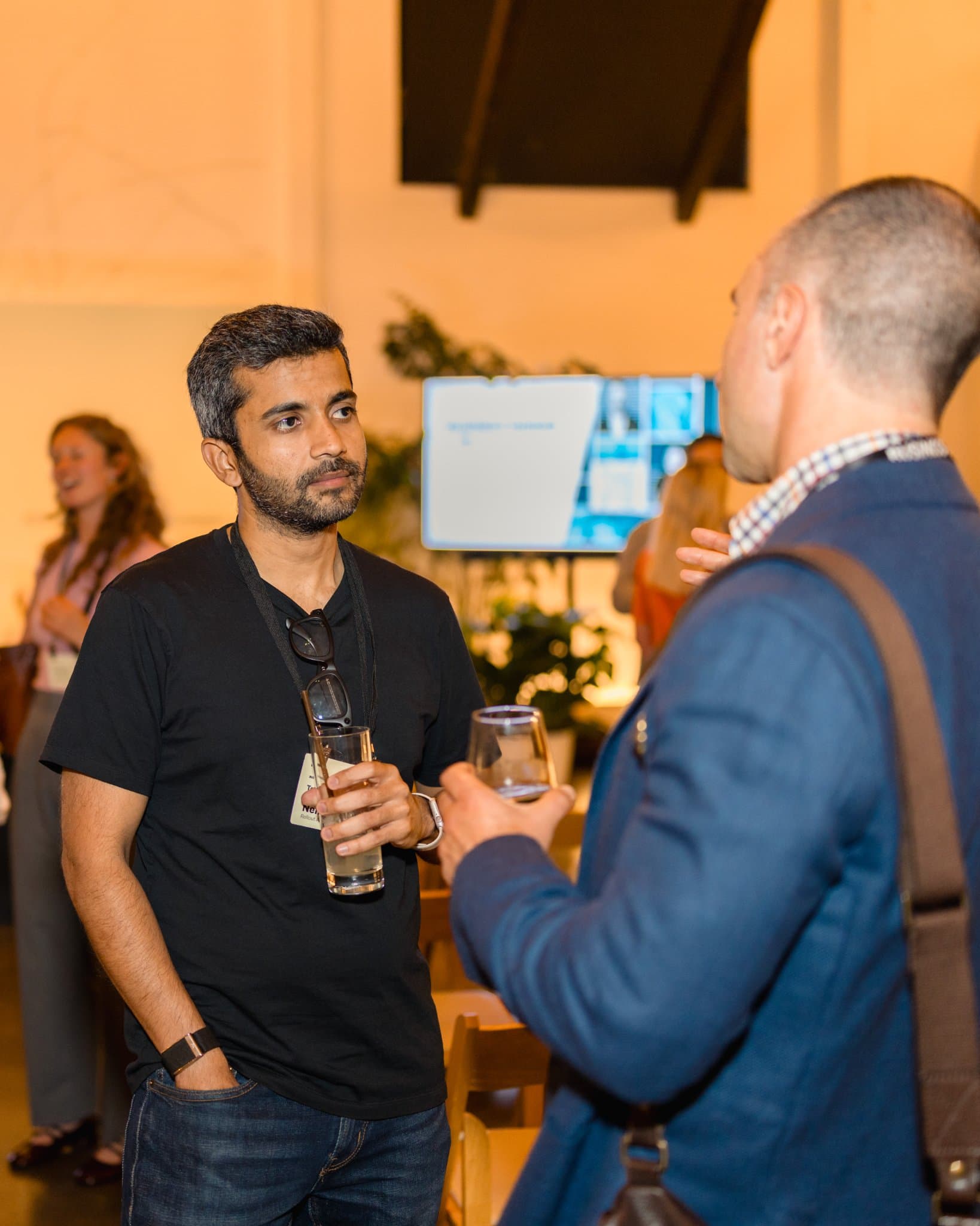 Attendees sharing a laugh during the networking reception at Business Insider Tech Insider: Growth Mode at The Pearl SF during SF Tech Week 2026 in San Francisco by JY Studio