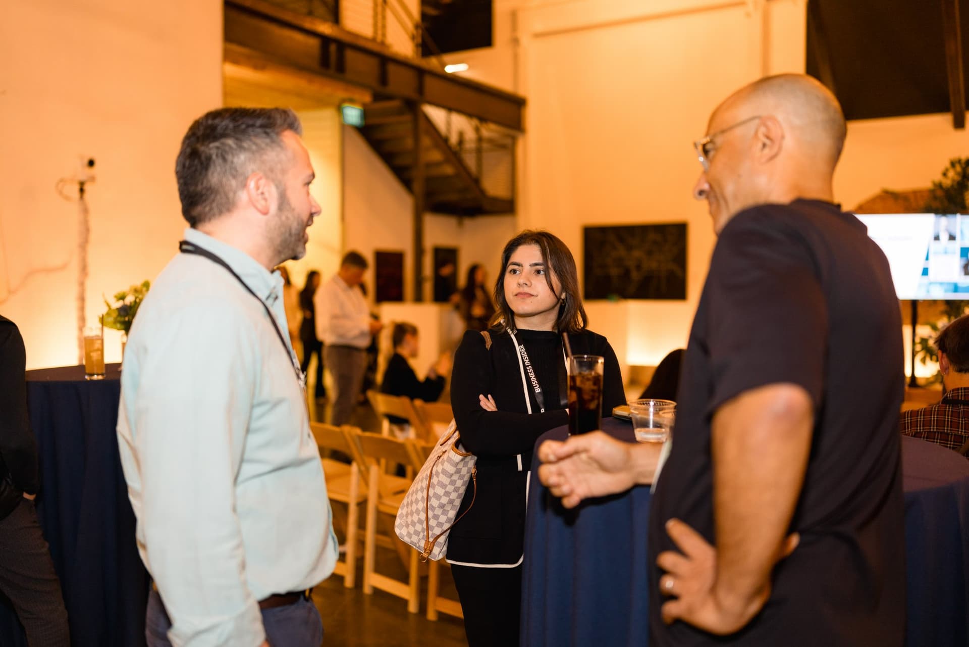 Attendees chatting with drinks under the venue's sculptural branches at Business Insider Tech Insider: Growth Mode at The Pearl SF during SF Tech Week 2026 in San Francisco by JY Studio