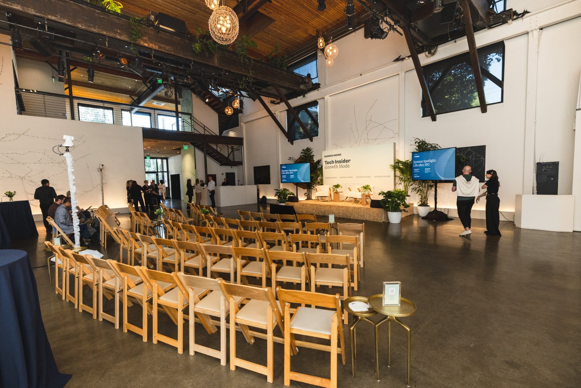 Wide view of The Pearl SF event venue in Dogpatch, San Francisco, set with rows of chairs for a panel, photographed by JY Studio
