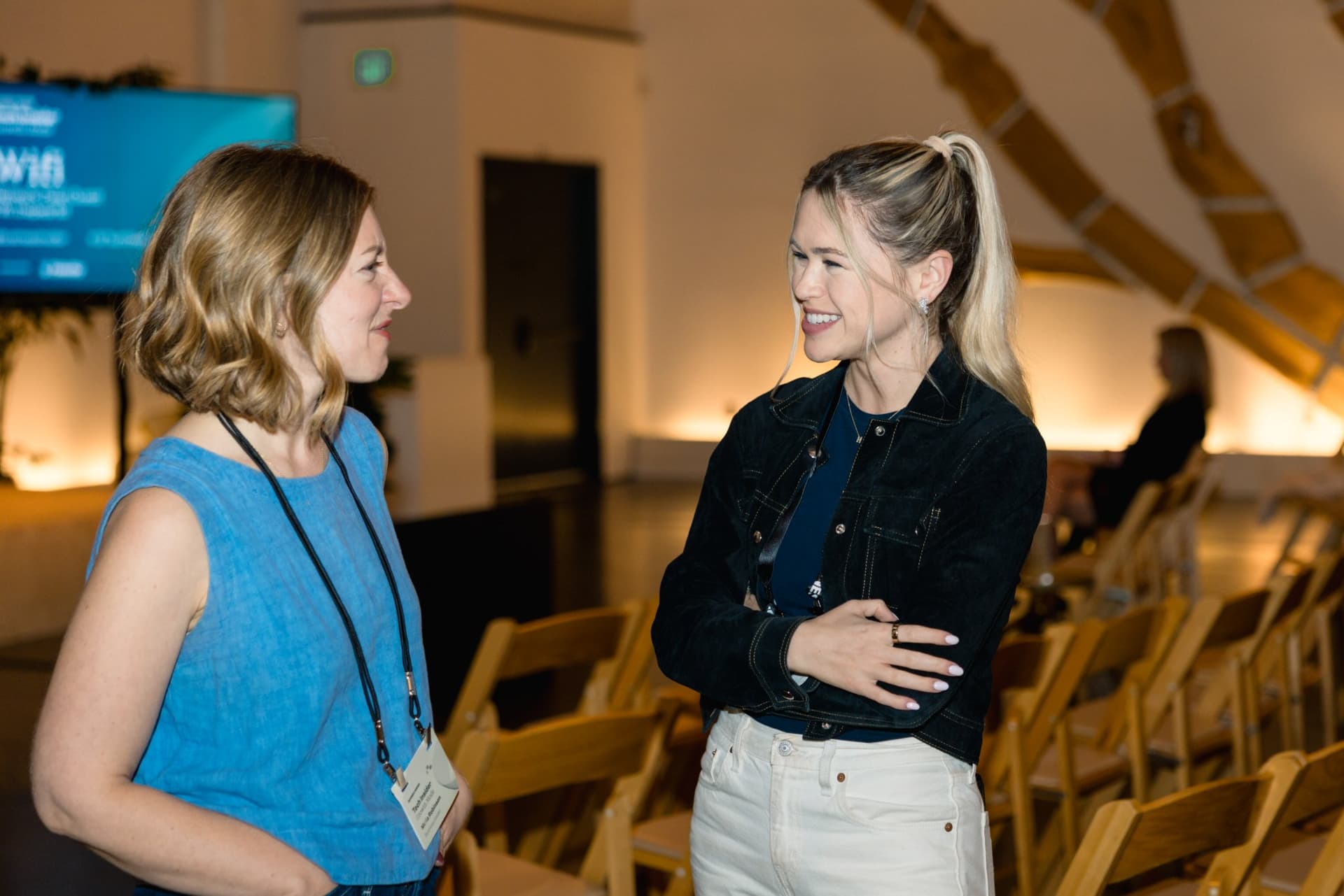 Two attendees chatting during the reception at Business Insider Tech Insider: Growth Mode at The Pearl SF during SF Tech Week 2026 in San Francisco by JY Studio