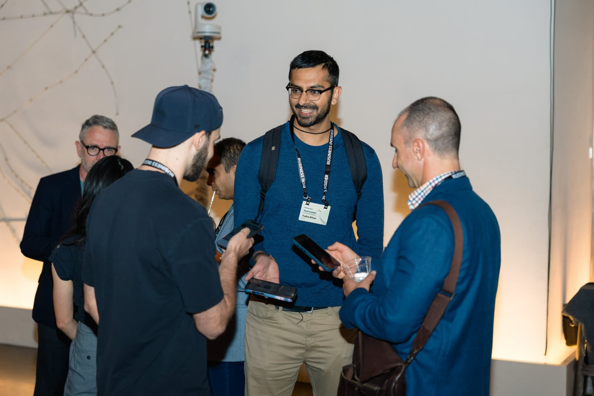 Attendees exchanging contacts on their phones at Business Insider Tech Insider: Growth Mode at The Pearl SF during SF Tech Week 2026 in San Francisco by JY Studio