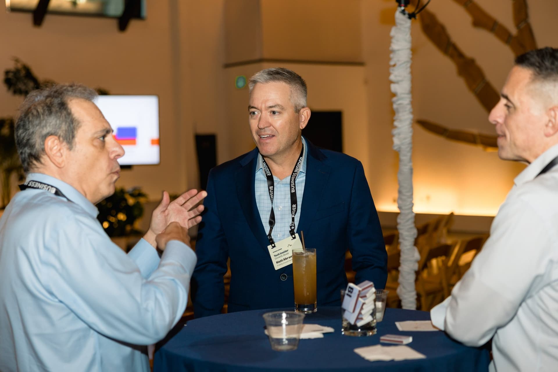Attendees talking over drinks at a cocktail table at Business Insider Tech Insider: Growth Mode at The Pearl SF during SF Tech Week 2026 in San Francisco by JY Studio